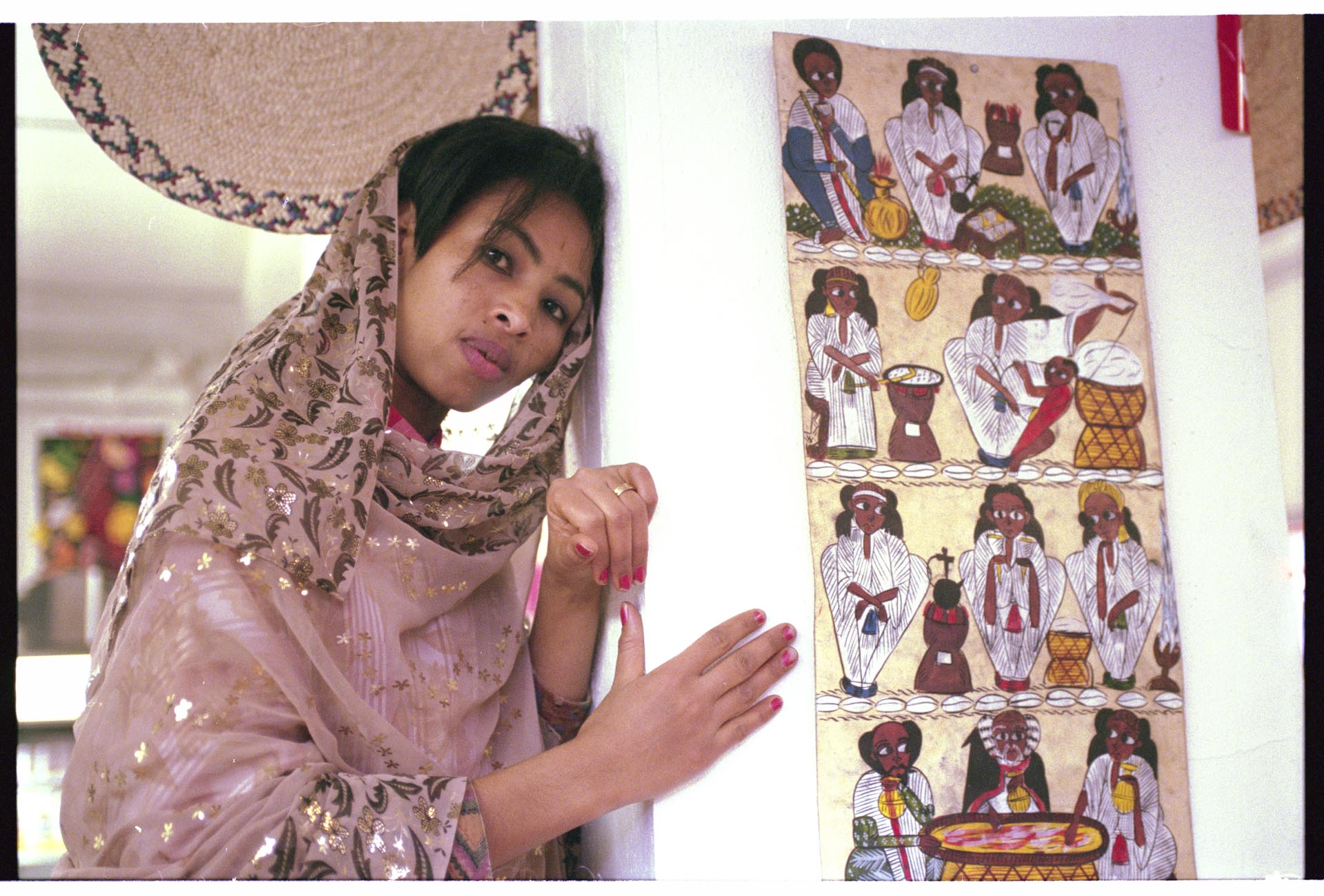 Image of Woman in traditional dress for Kwanzaa celebration, December 29, 1995