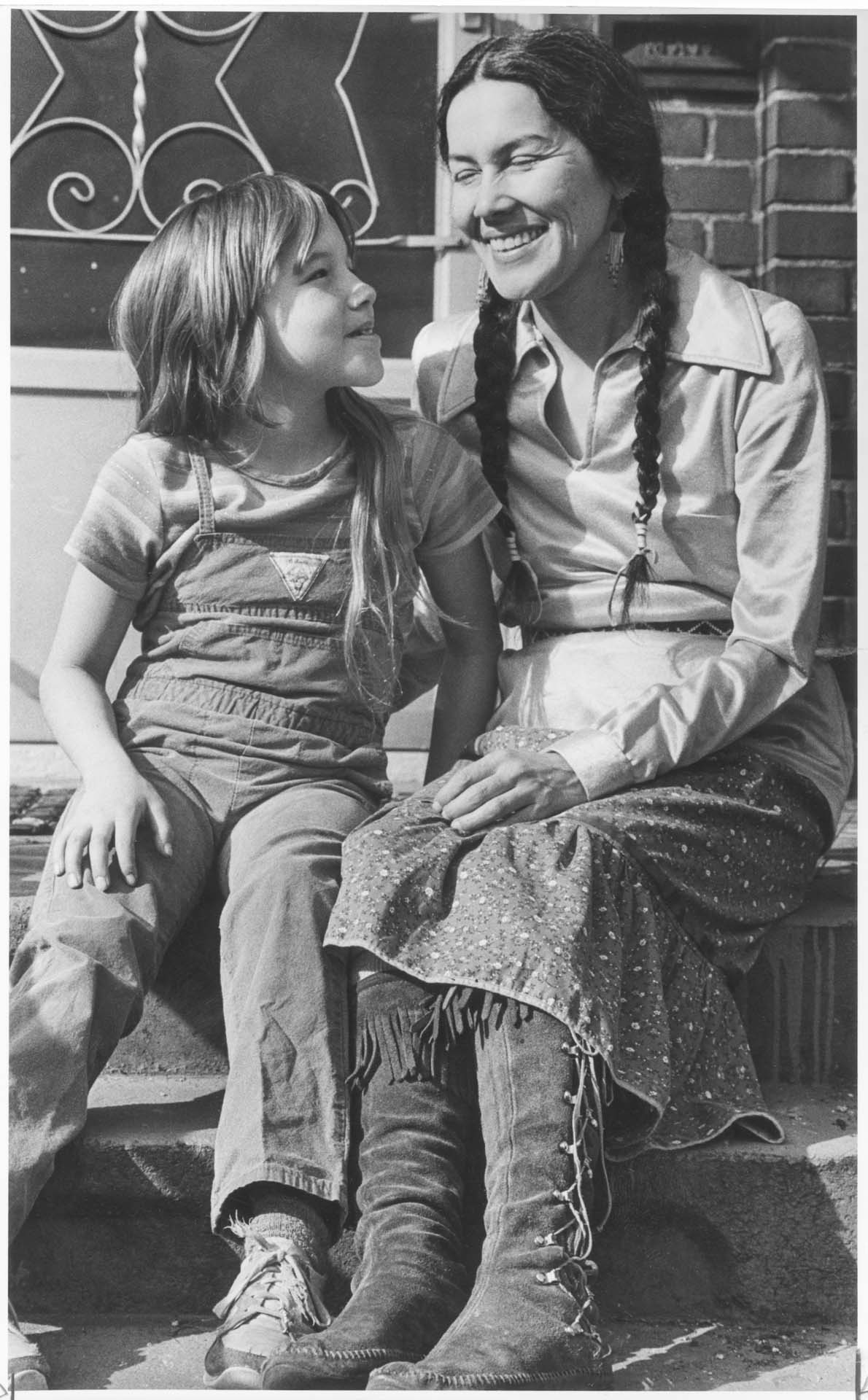 Image of Yvonne (Wanrow) Swan and her daughter sitting on steps, April 7, 1983