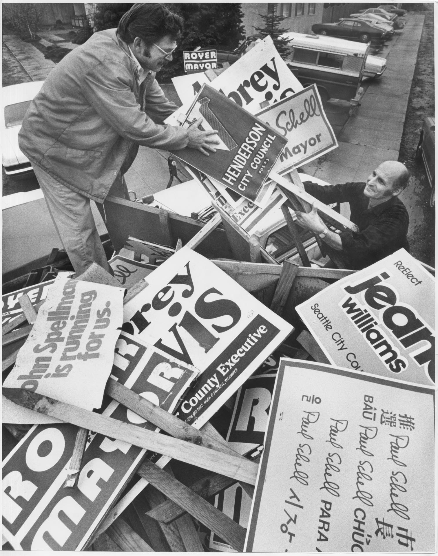 Image of Cleaning up campaign signs along Rainier Avenue, Seattle, November 9, 1977