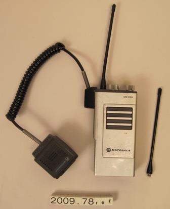 Image of One of two Motorola handheld radios, used by Direct Action Network during the WTO protests, 1999