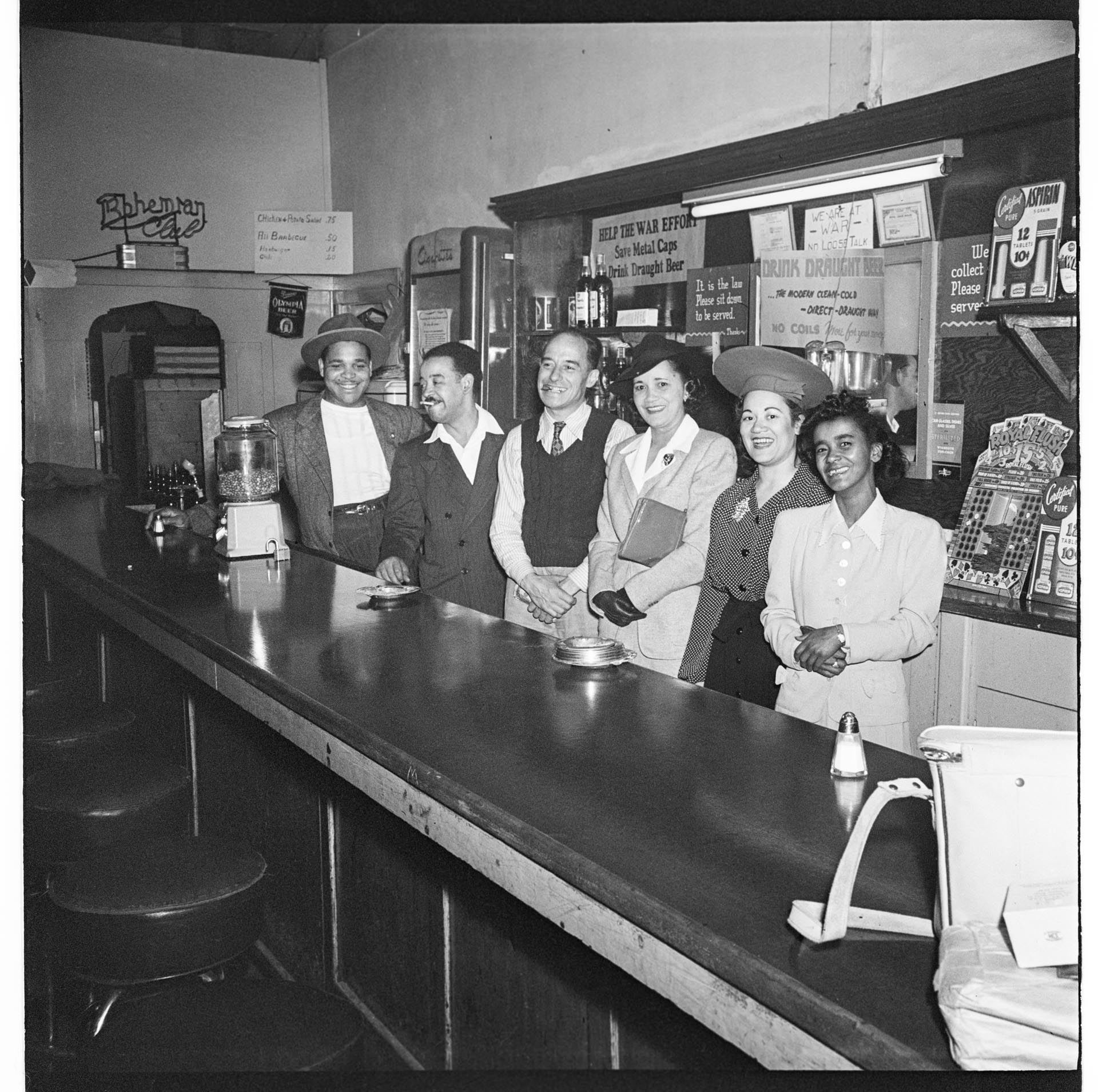 Image of Six people posing behind a bar, Seattle, circa 1944