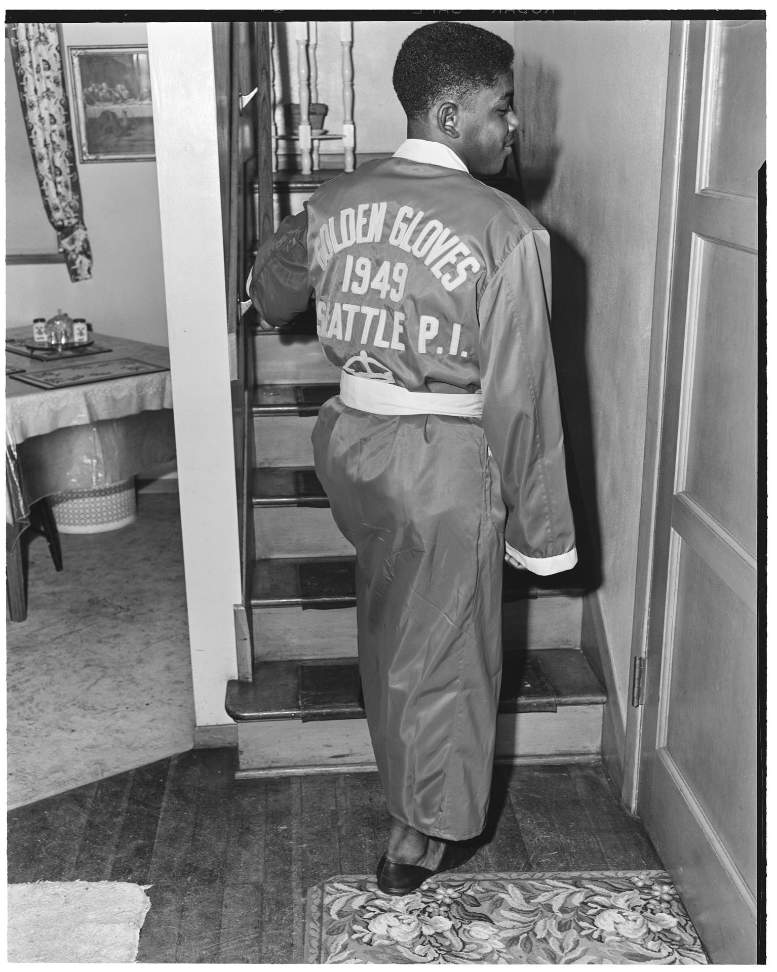 Image of Freddie Brown wearing his Golden Gloves championship robe, Seattle, February 24, 1949