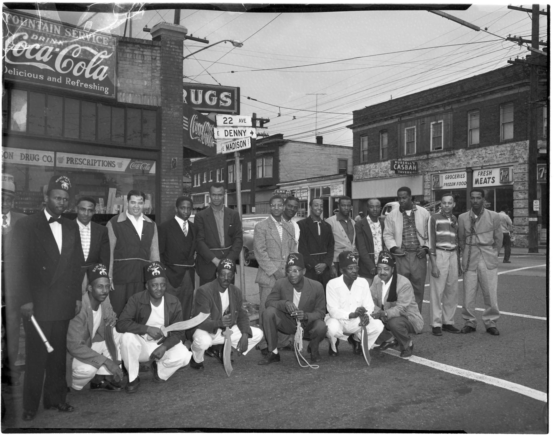 Image of Group of Beni Hassan shrine members outside Gideon's Drugstore, Seattle, circa 1950