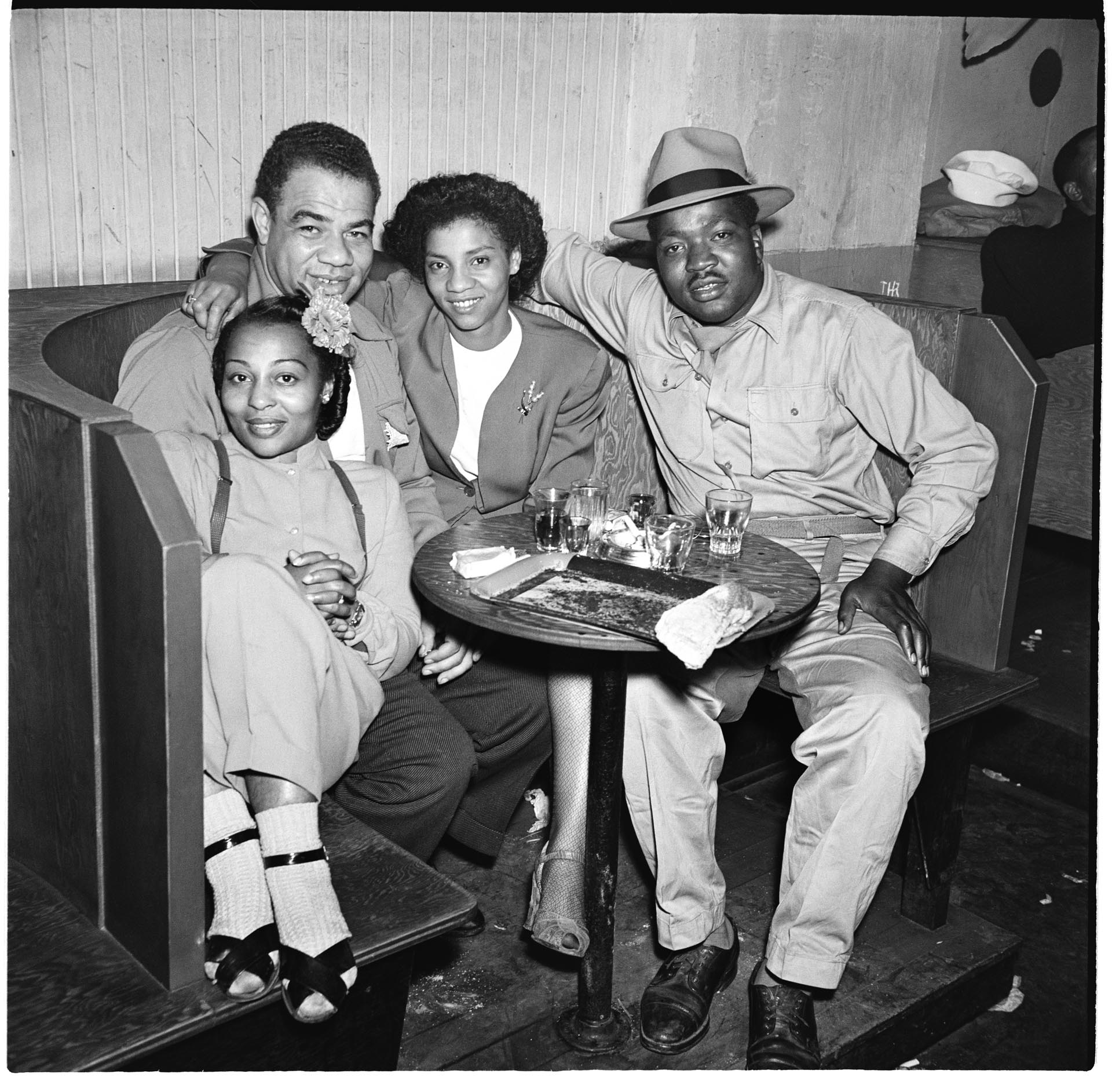 Image of Four people in a booth at the Basin Street  nightclub, July 1945