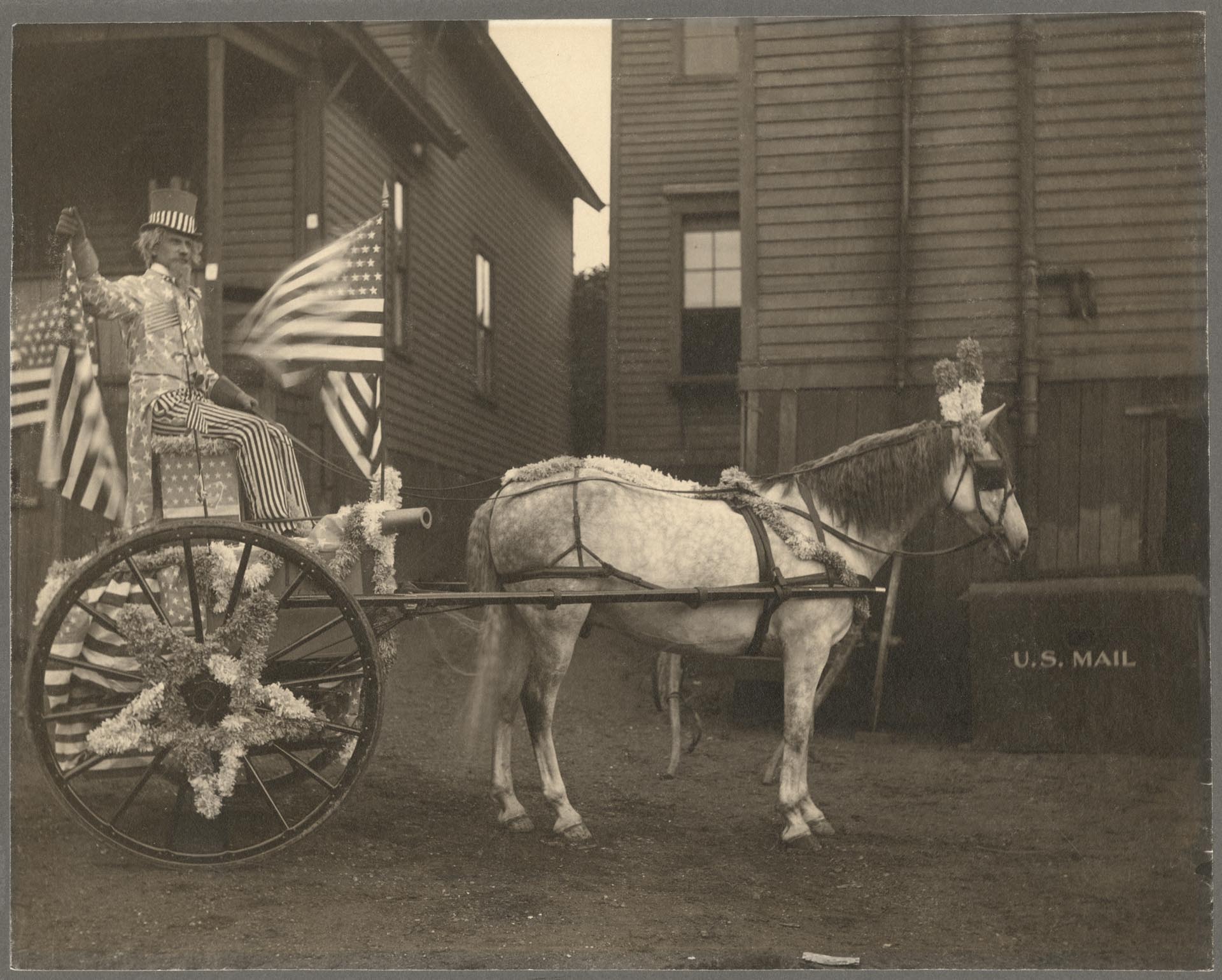 Image of John C. deHaas driving cart dressed up as 