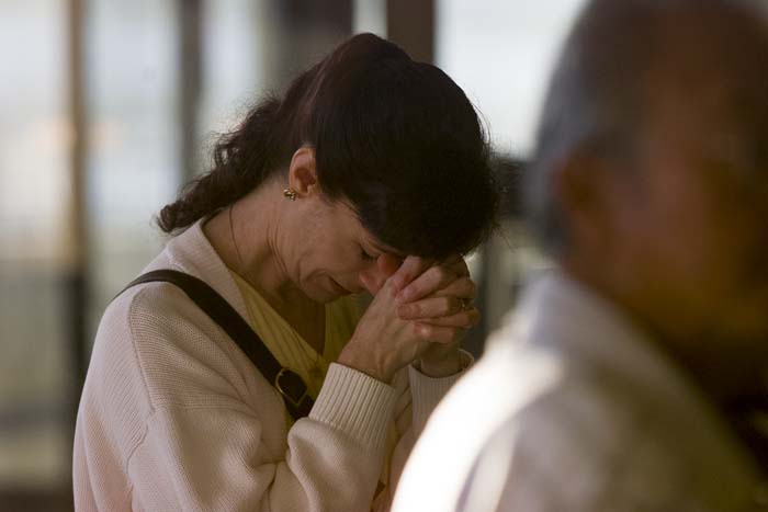 Image of Woman at Sea-Tac airport reacting to news report, September 11, 2001