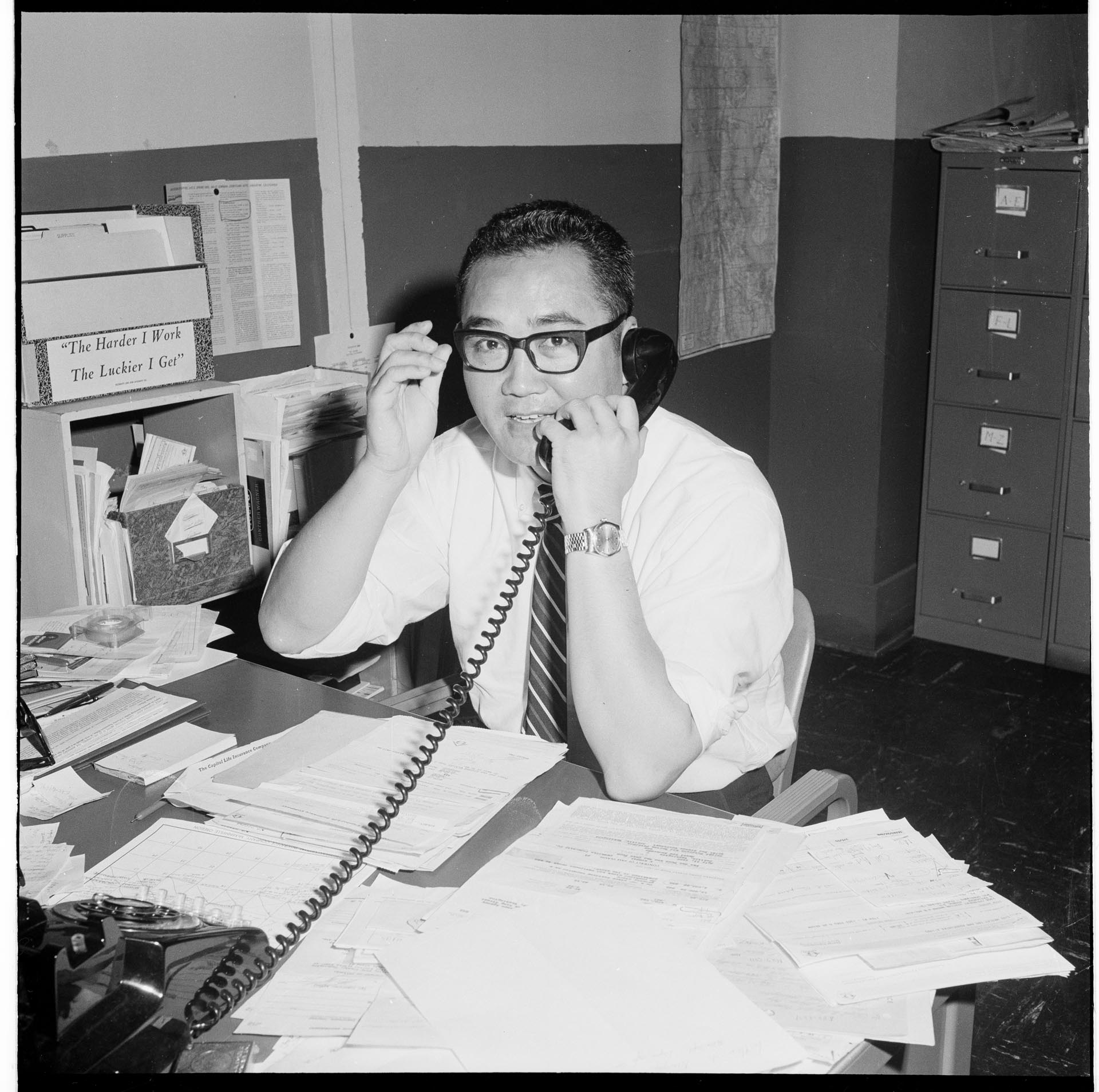 Image of Wesley Tao in his office, Seattle, July 1965