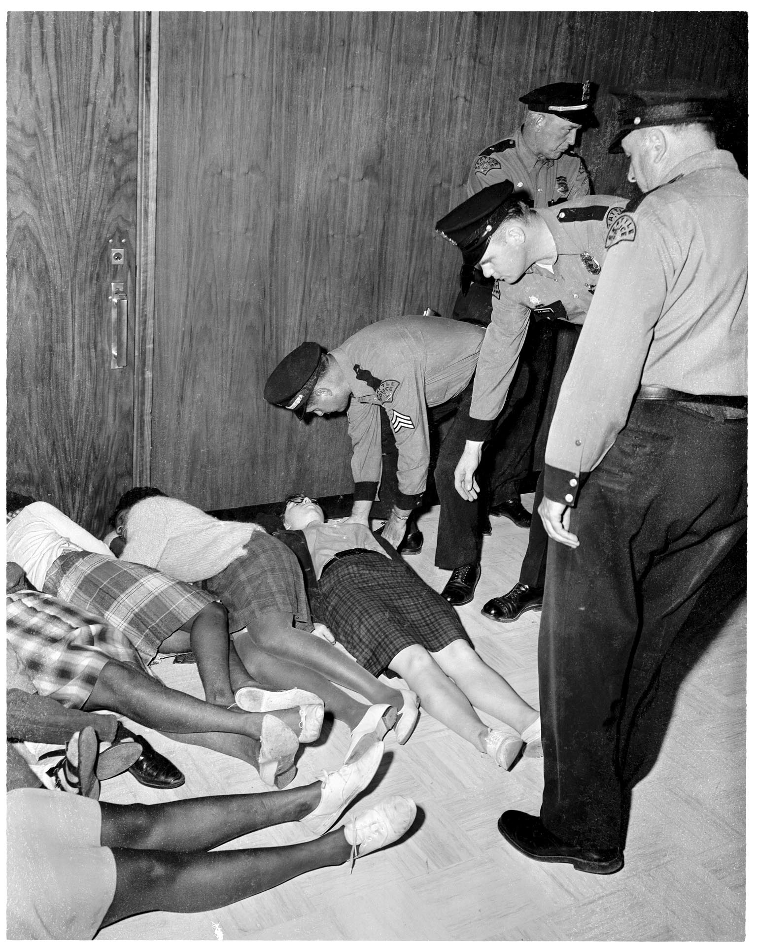 Image of Police removing demonstrators at City Hall, Seattle, July 25, 1963