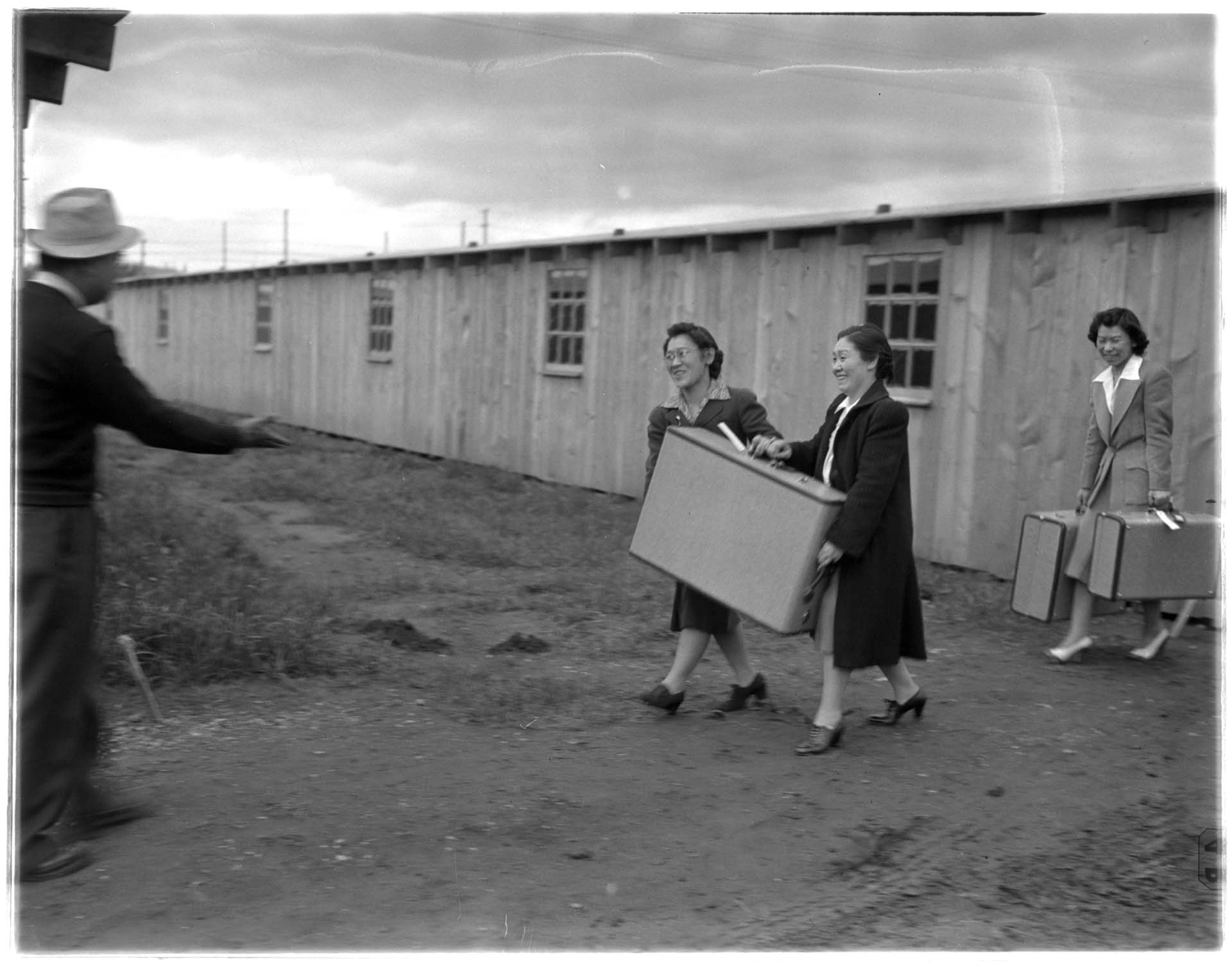 Image of Incarcerees moving into barracks at the Puyallup Assembly Center, Puyallup, March 1942