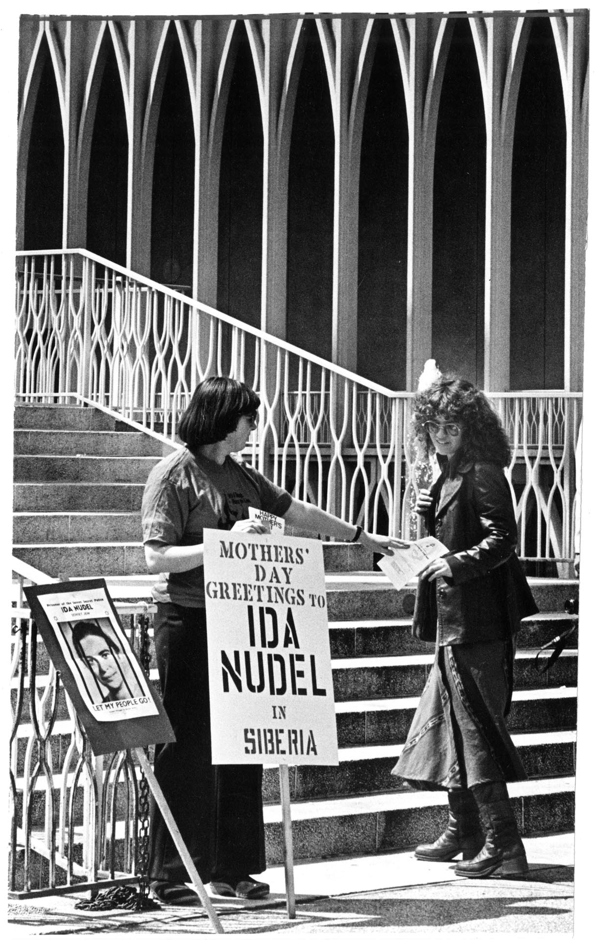 Image of Judy Balint protesting at 