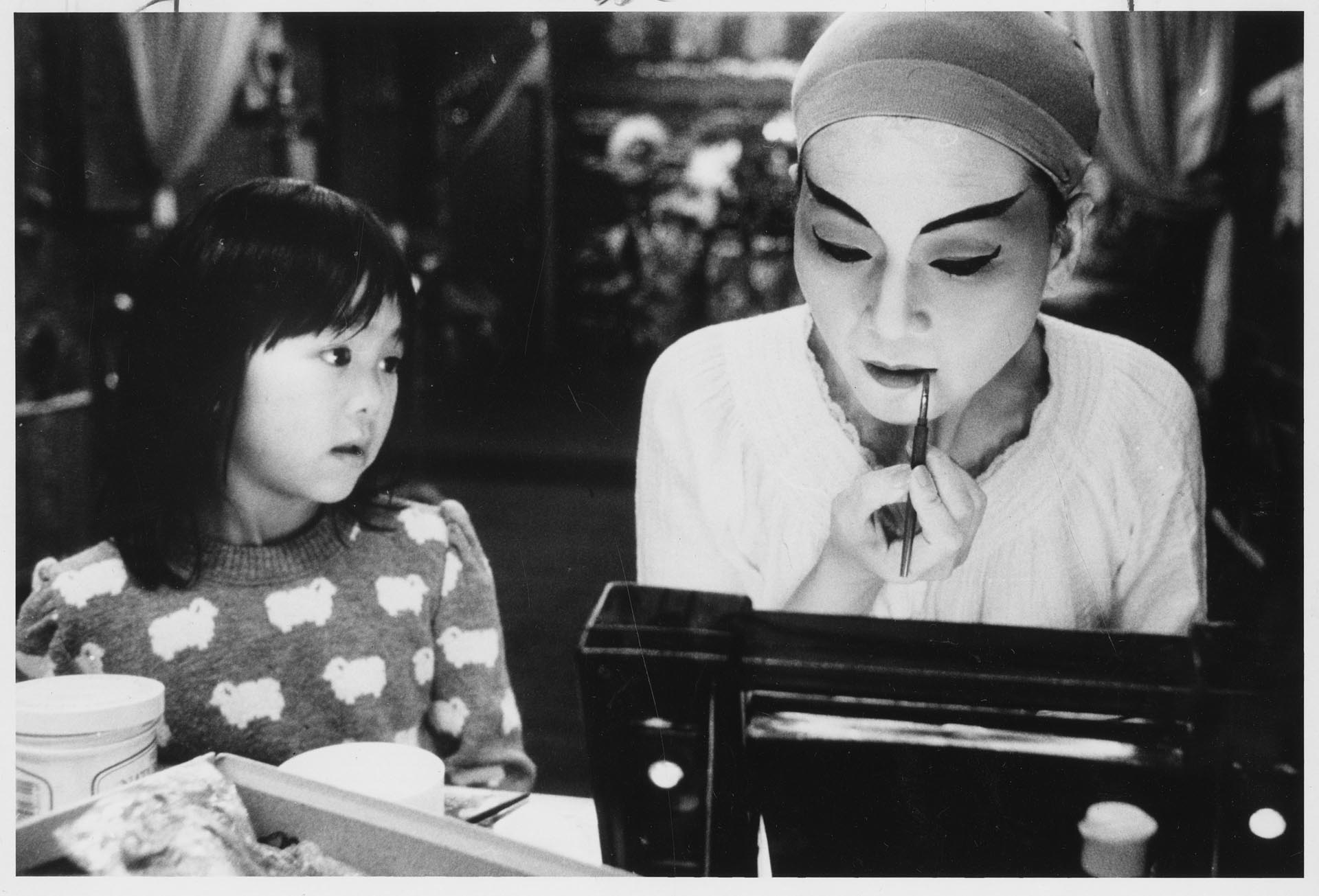 Image of Lucy Lee applying make up for Chinese opera role, Seattle, November 26, 1984