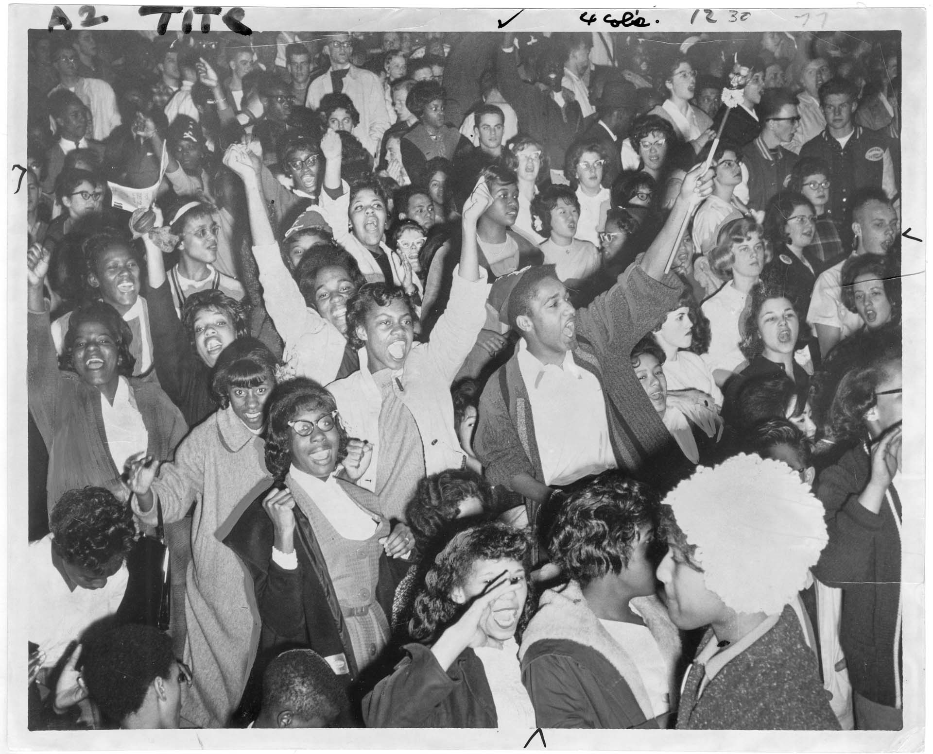 Image of Garfield High School students cheering basketball victory, March 1961