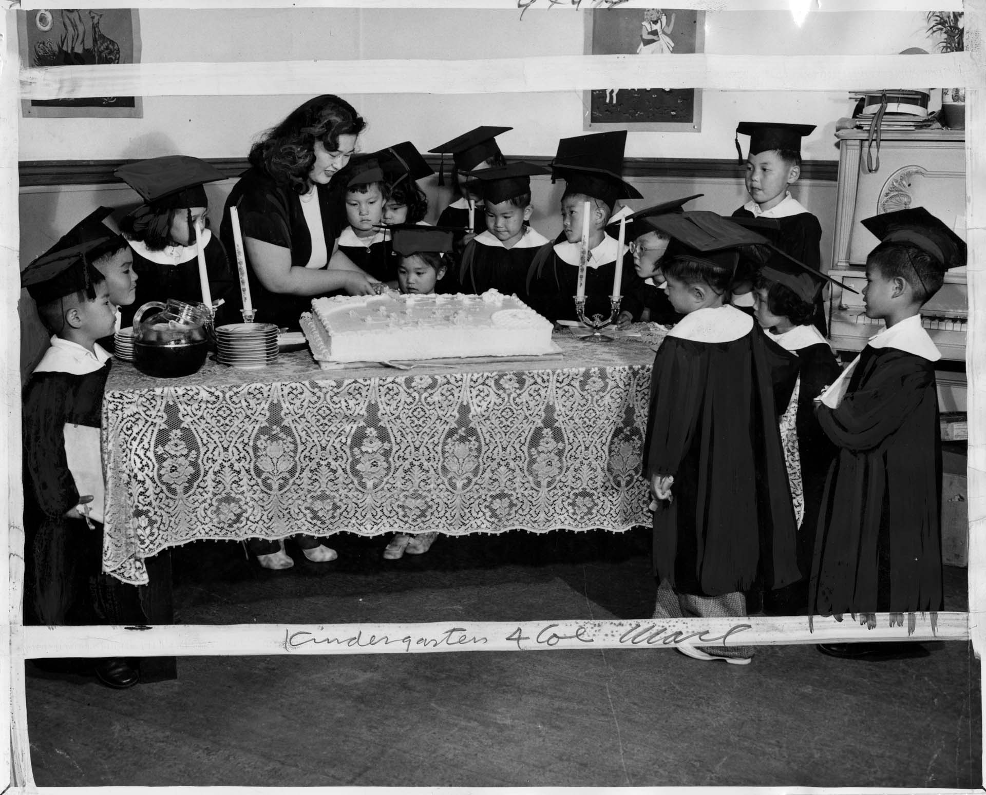 Image of Sallie Onishi cutting cake for her young students, Japanese Baptist Church, Seattle, July 1, 1948