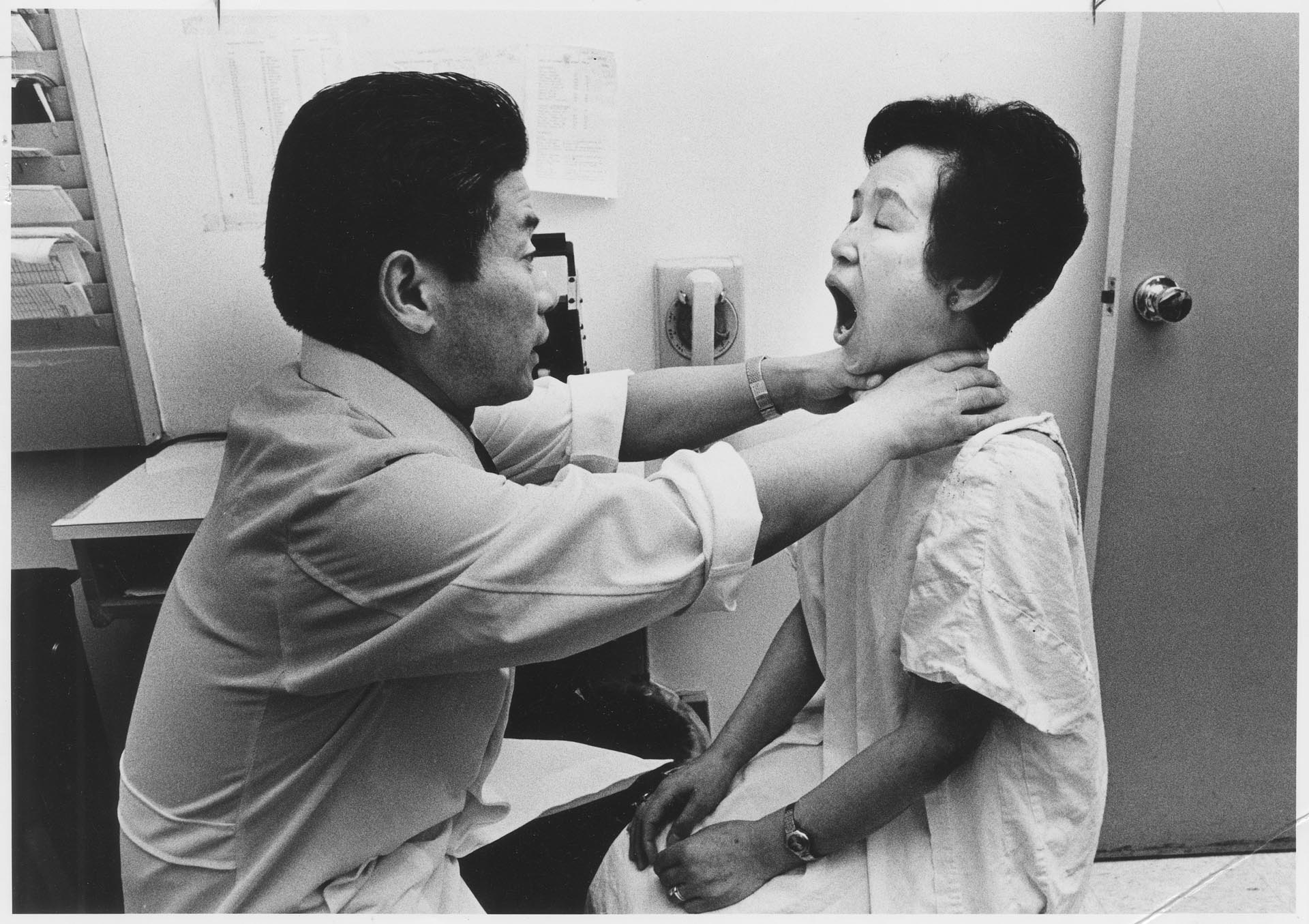 Image of Rikuko Tanaka being examined by Dr. Michio Yamakido, Seattle, May 23, 1981