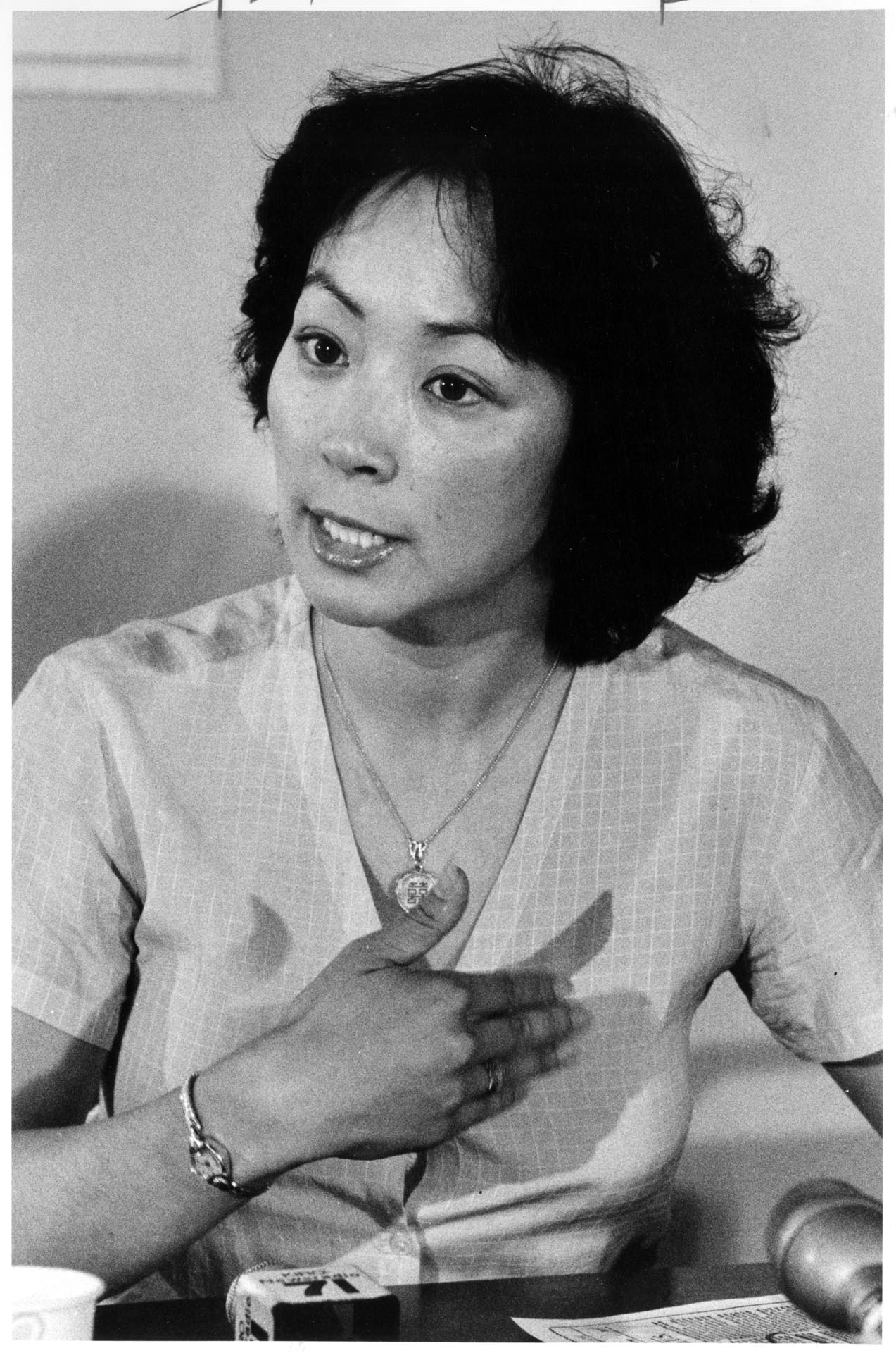 Image of Elaine Ko speaking at press conference, Seattle, August 5, 1982