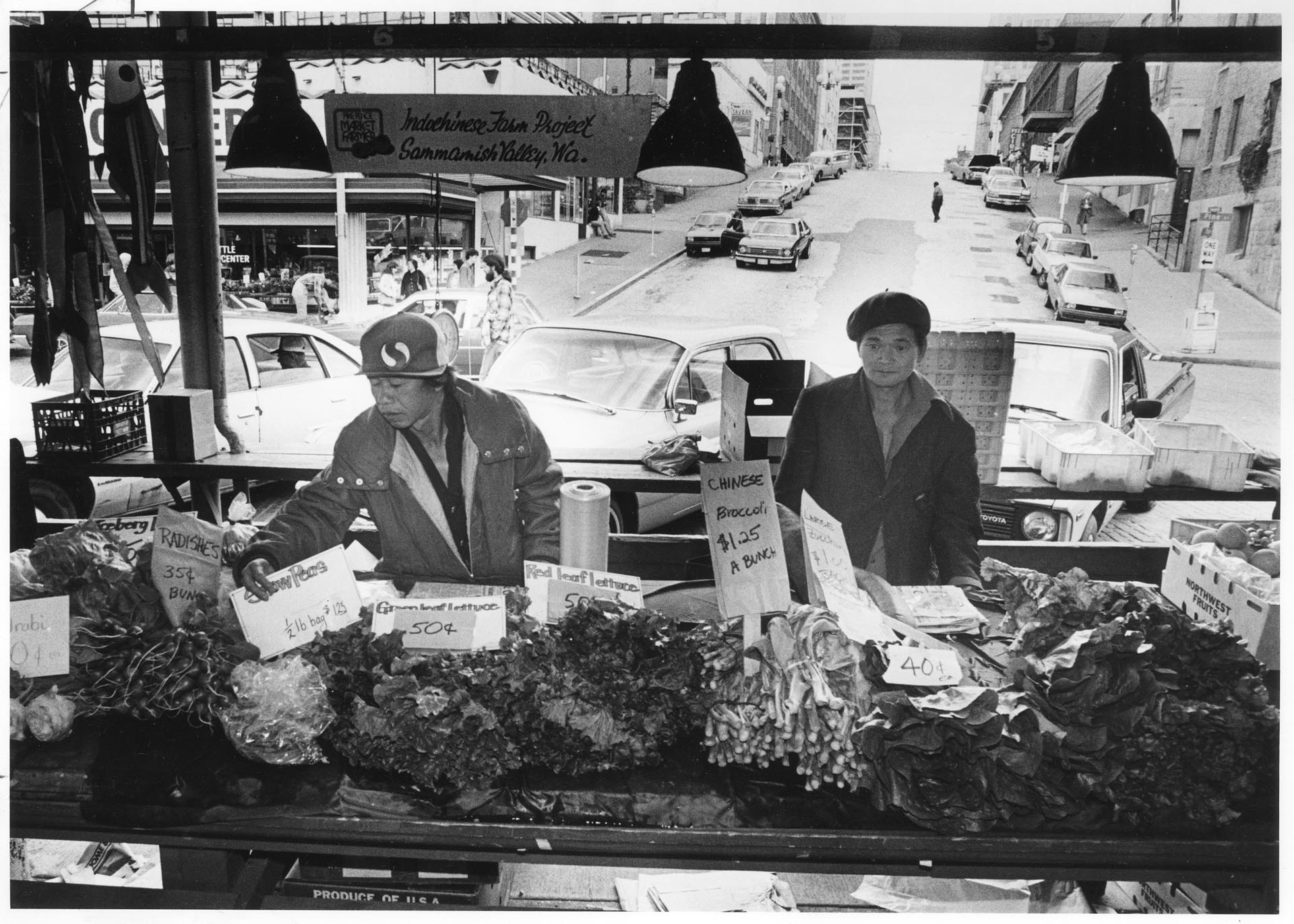 Image of Footong Tsoy Saelee and Choi Saechao selling produce at Pike Place Market, Seattle, July 21, 1982