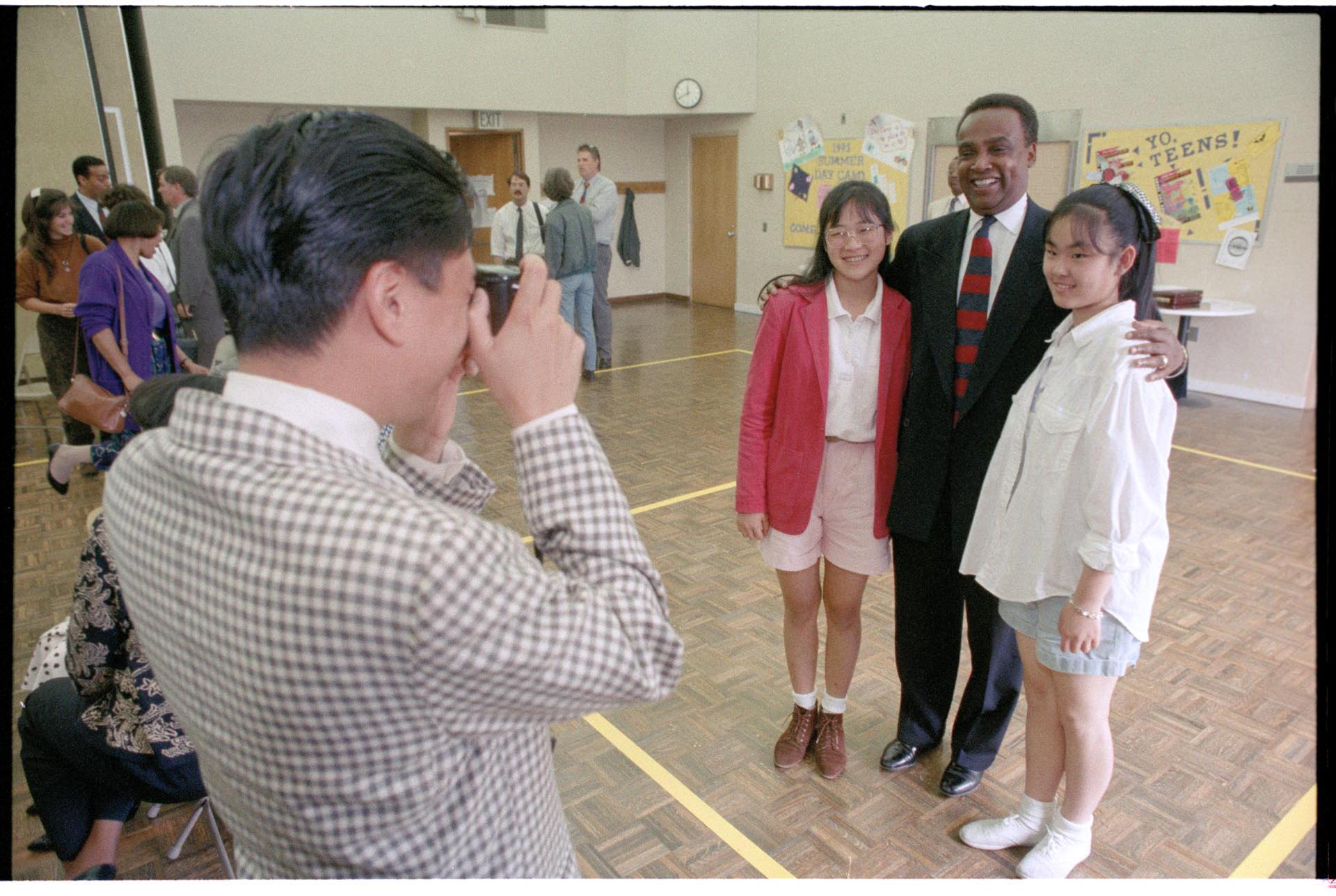Image of Recent emigres posing with Norm Rice, July 16, 1993