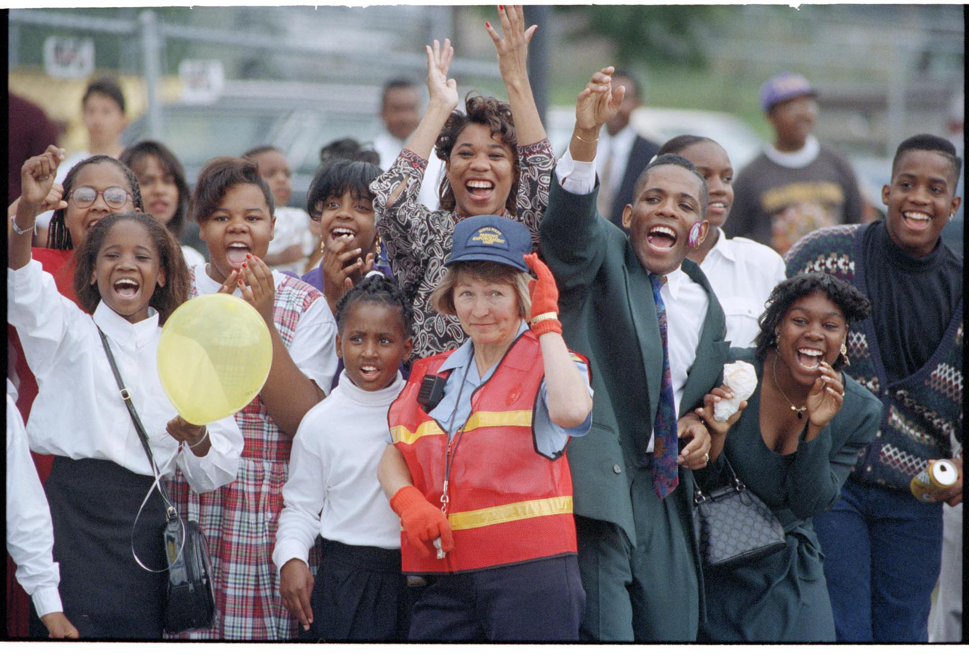 Image of Smiling spectators at Mardi Gras parade, July 25, 1993