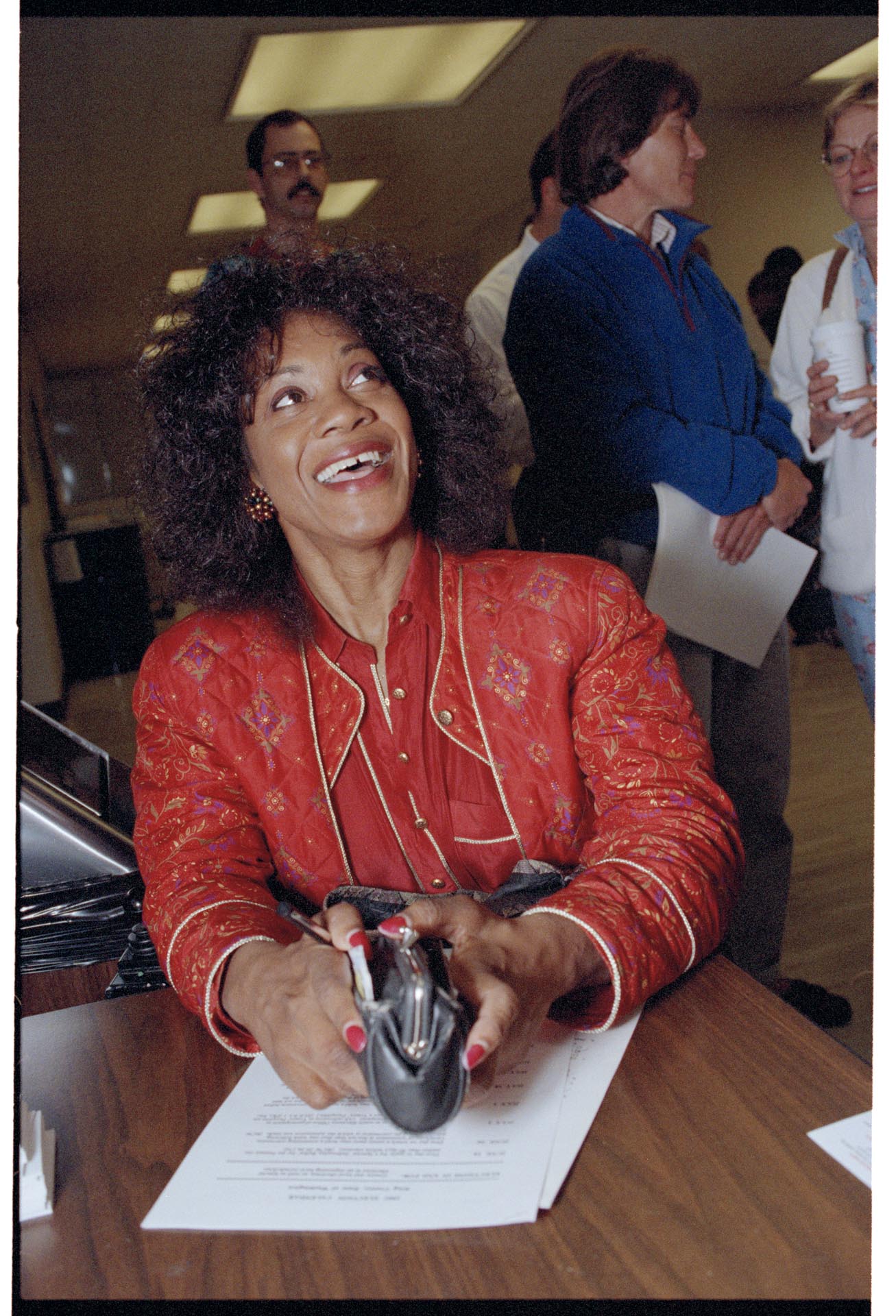 Image of Re'Gena Bell filing paperwork as City Council candidate, Seattle, July 26, 1993