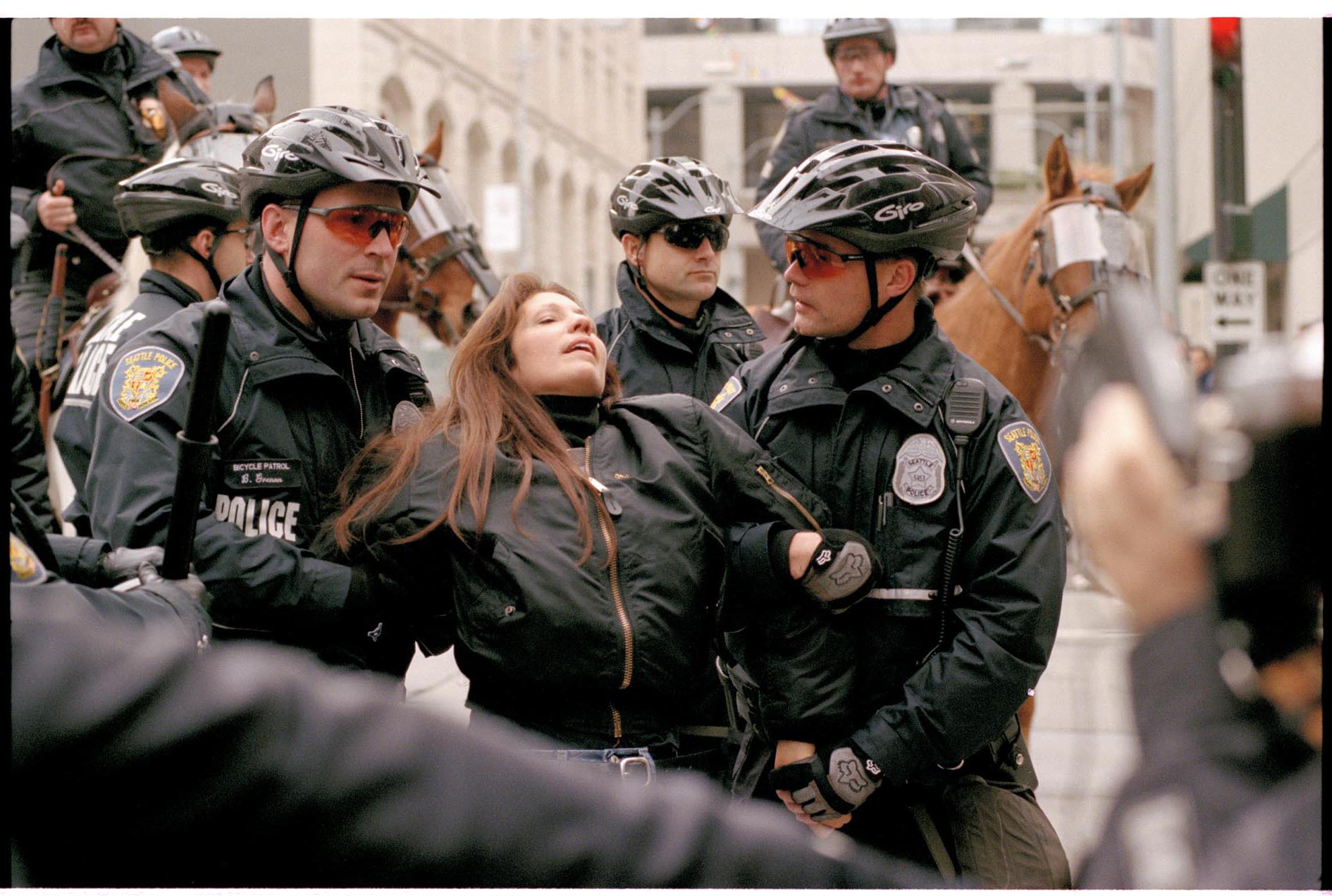 Image of Cheri Honkala being arrested by police at WTO protest, Seattle, November 29, 1999
