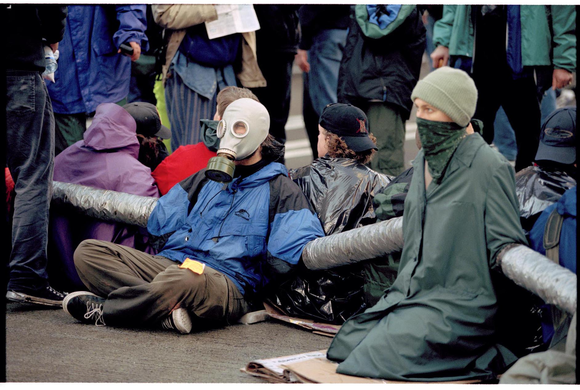 Image of Protesters sitting with joined arms at WTO protest, Seattle, November 30, 1999