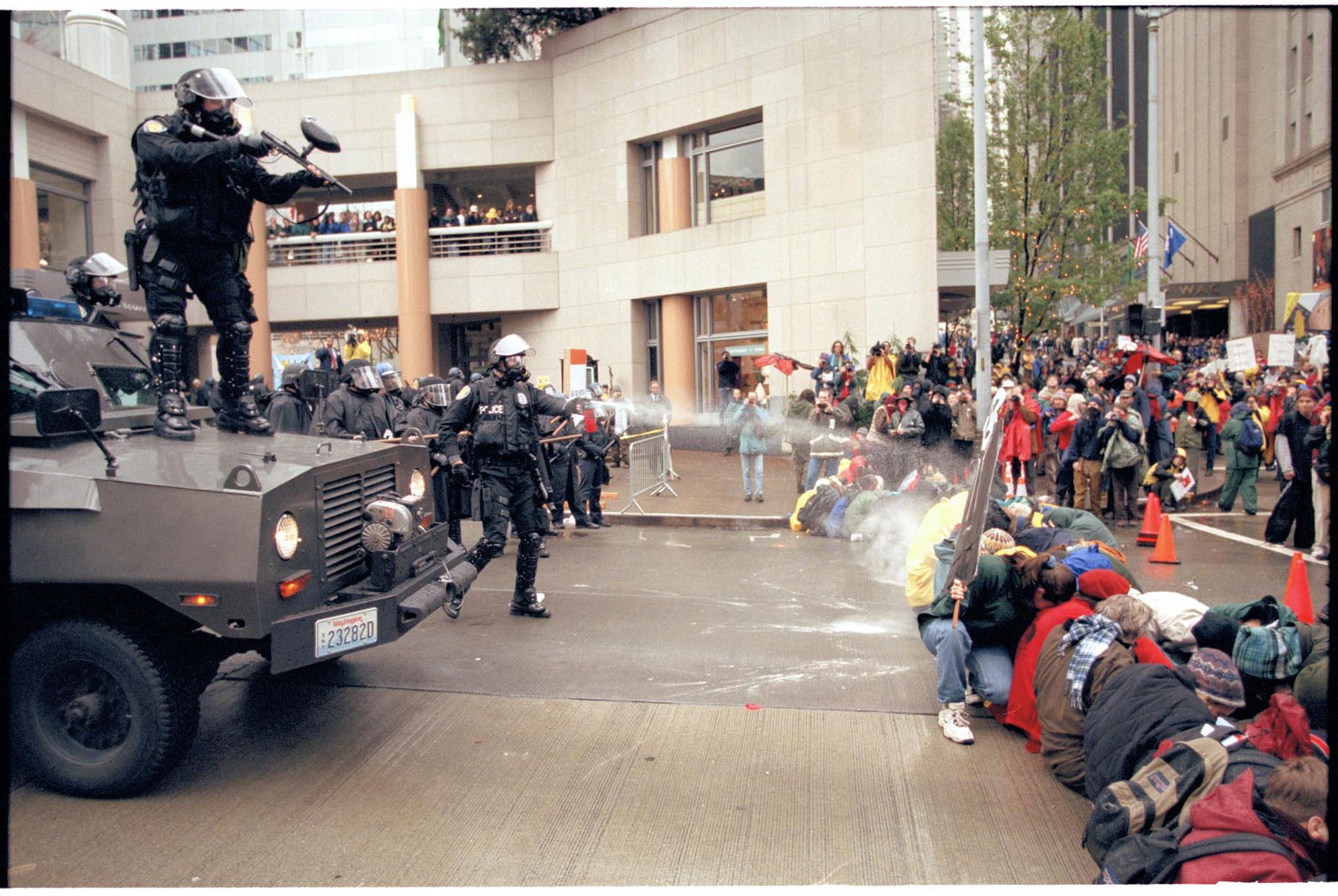 Image of Police firing pepper spray at WTO protesters, Seattle, November 30, 1999