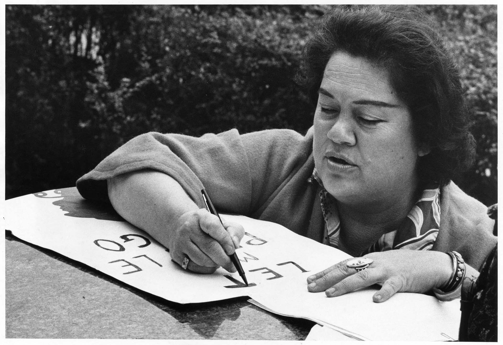 Image of Grace Thorpe making sign for protest at courthouse, Seattle, March 16, 1970