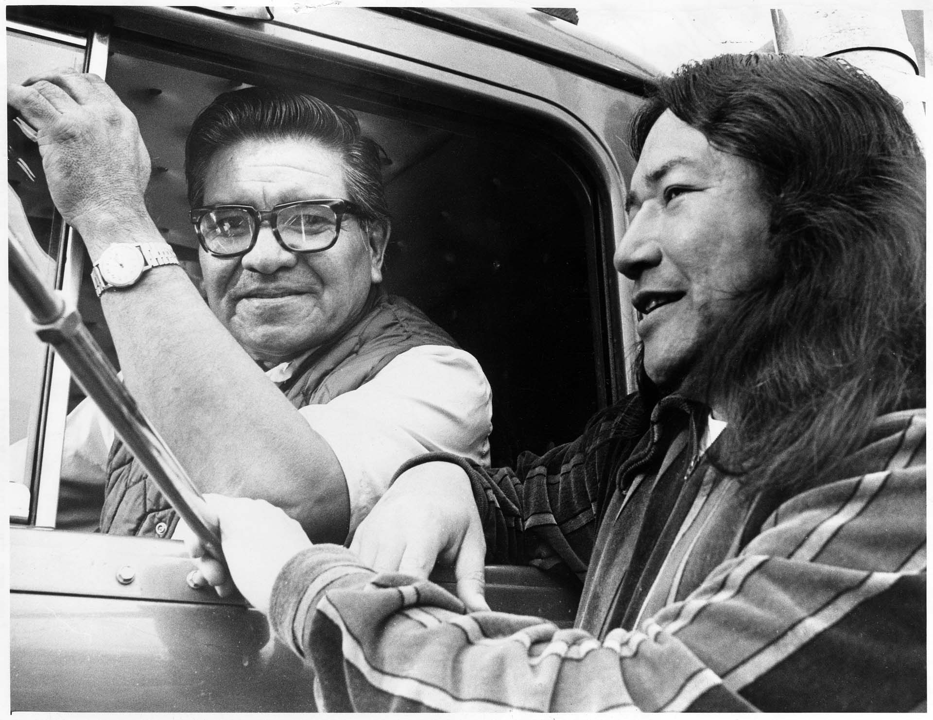 Image of Bernie Whitebear receiving lumber delivered by Bill Boyd, Seattle, November 10, 1974