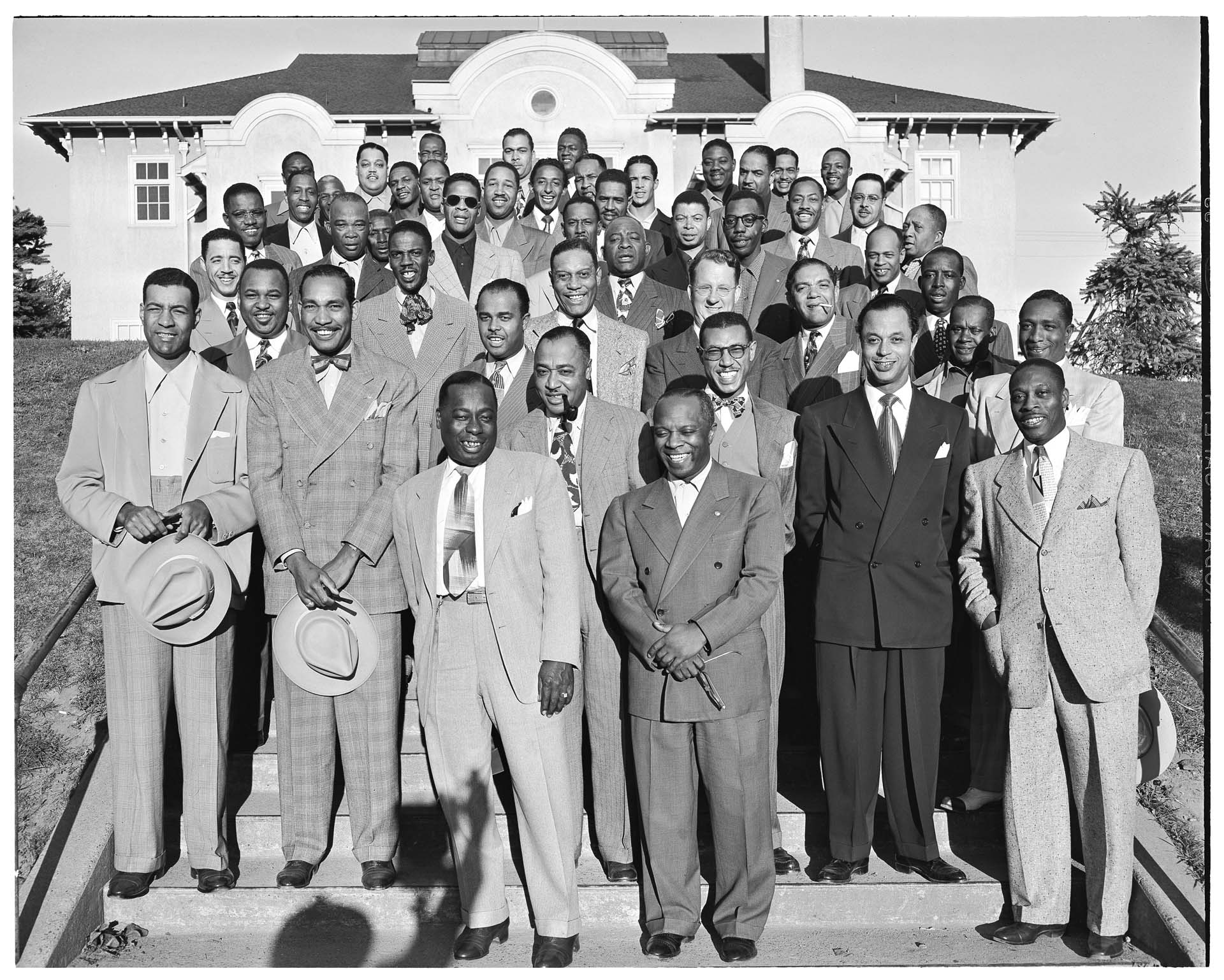 Image of Members of the Royal Esquire Club on steps of Collins Field House, Seattle, September 11, 1949