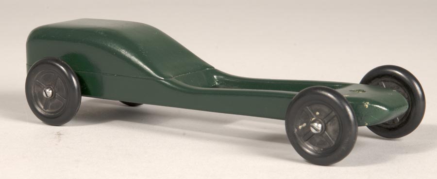 Image of Sleek and sporty green pinewood derby car, one of four, made by Jim Smith, ca. 1995-2010