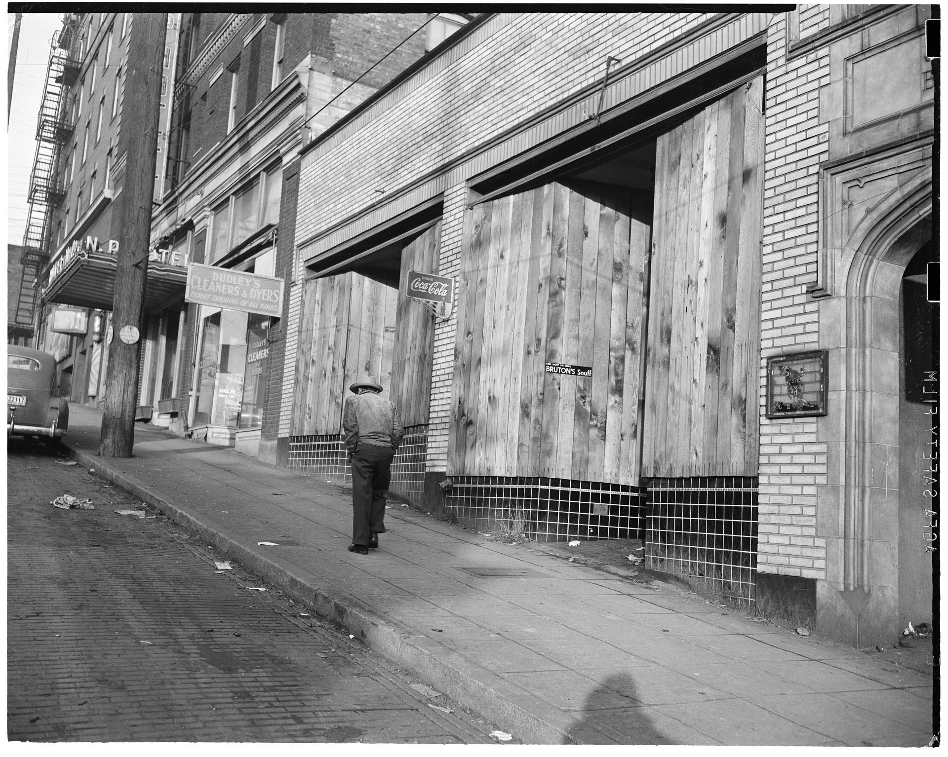 Image of Boarded up storefronts on 6th Ave. S  after forced removal of Japanese Americans, Seattle, June 1942