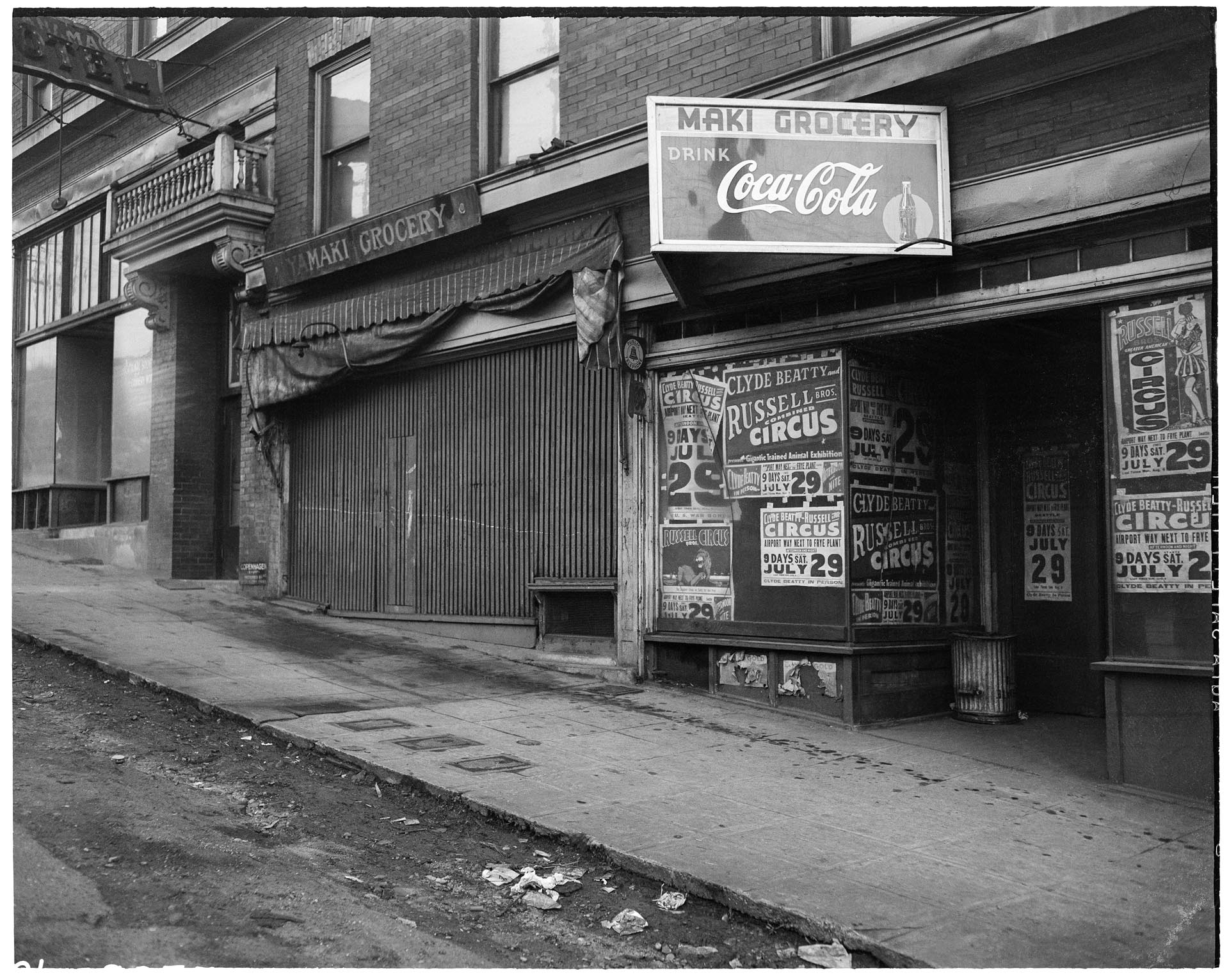 Image of Closed businesses on  S. Main St. after forced removal of Japanese Americans, Seattle, June 1942