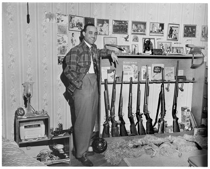 Image of Joe Smith with his gun collection, circa 1948