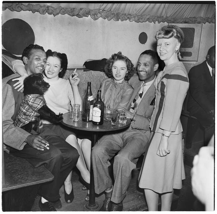Image of Group around a table at the Basin Street nightclub, circa 1945