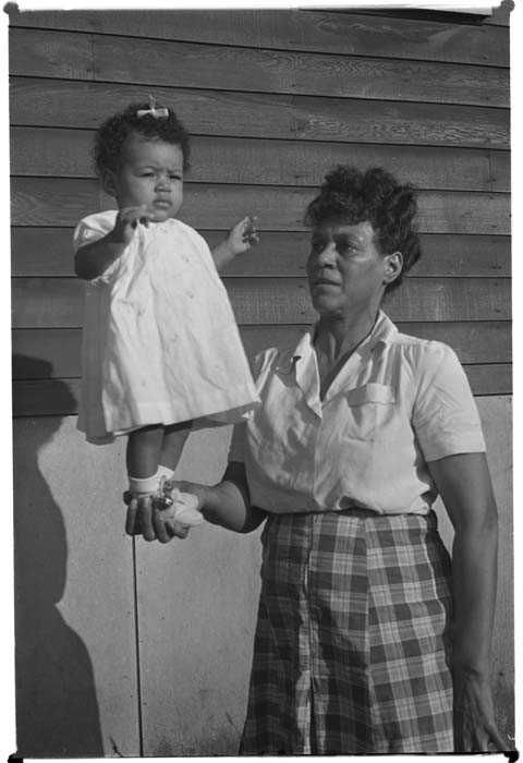 Image of Woman balancing baby, Seattle, circa 1942