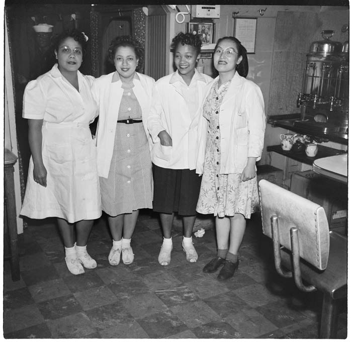 Image of Four women, possibly staff from the Basin Street Club, circa 1943