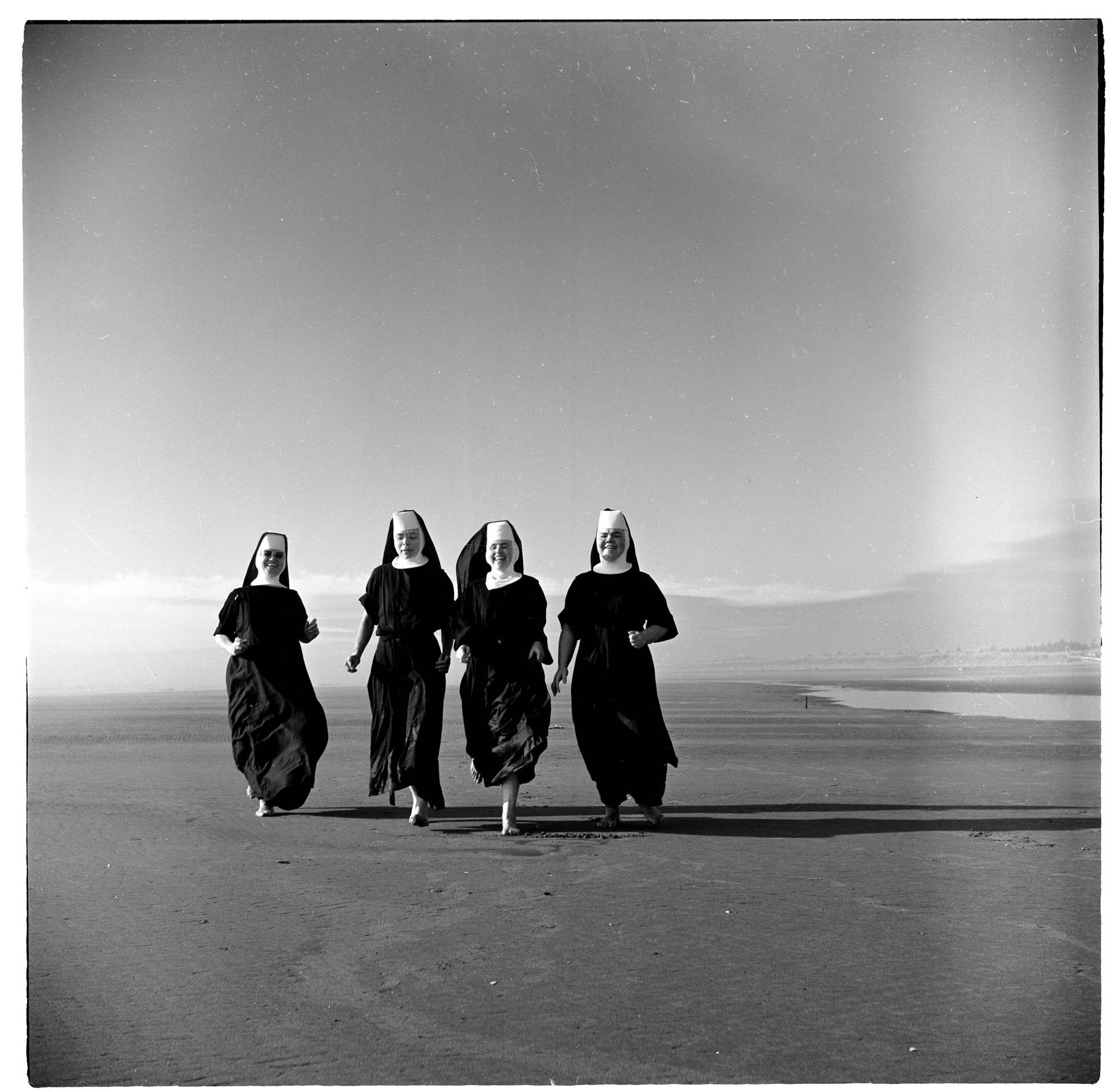 Image of Seattle-area nuns walking on beach at Grayland, WA, August 1960