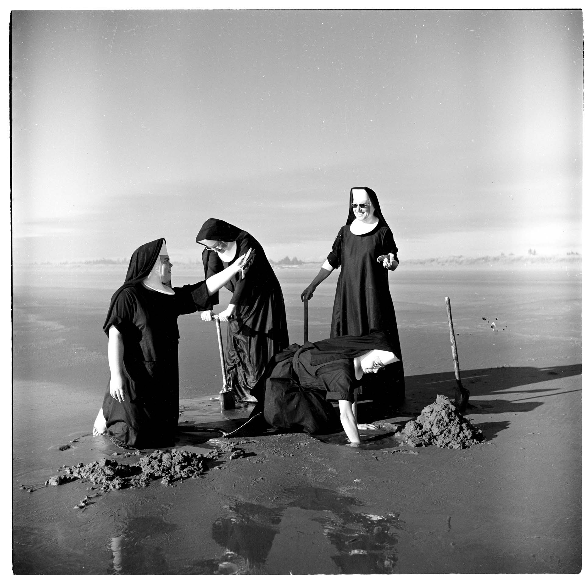 Image of Seattle-area nuns digging for clams, Grayland, WA, August 1960