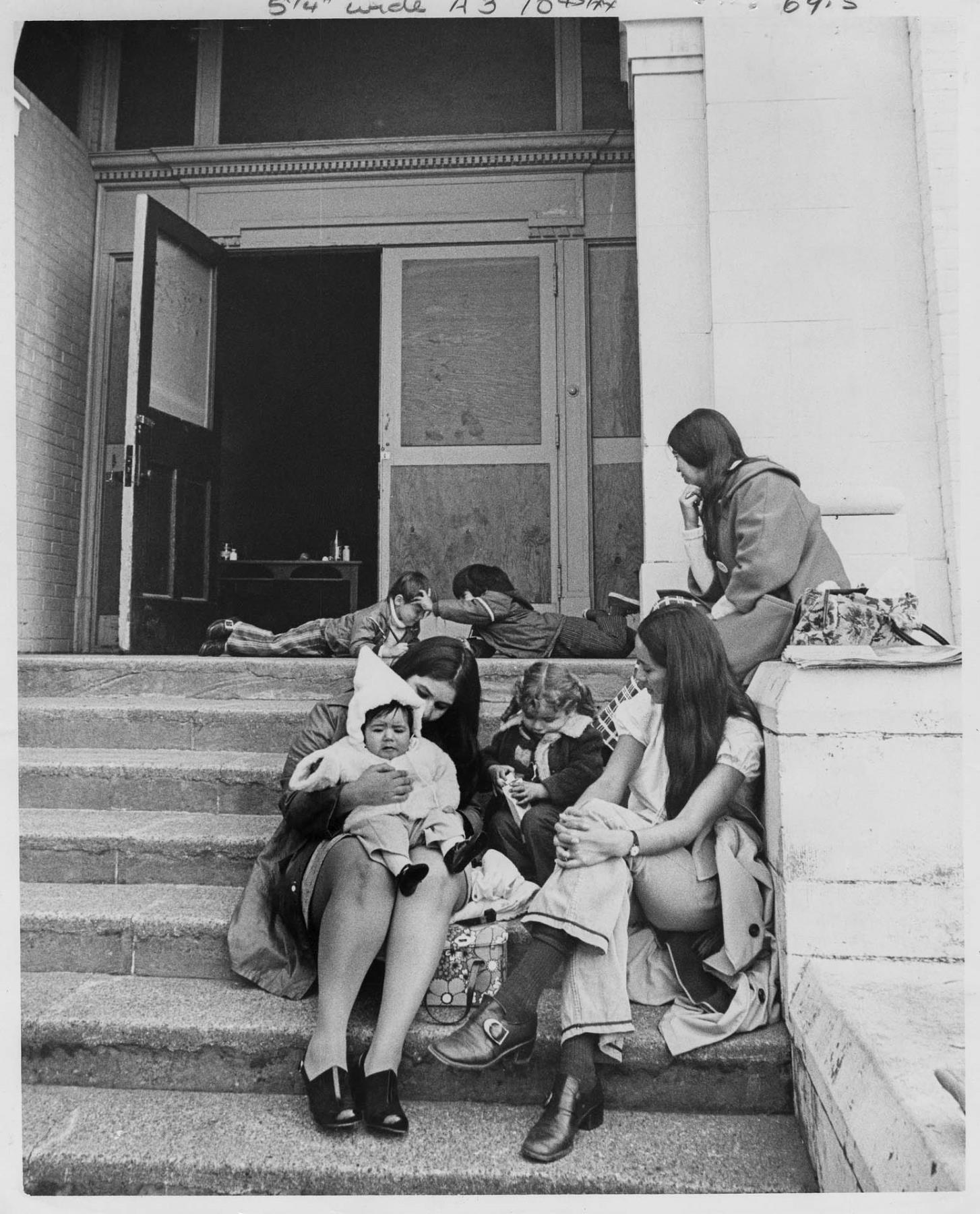 Image of Women and children on steps of Beacon Hill School during occupation, October 1972