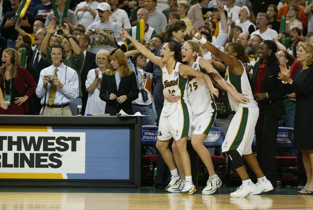 Image of Seattle Storm players cheering at WNBA championship game, Seattle, October 12, 2004