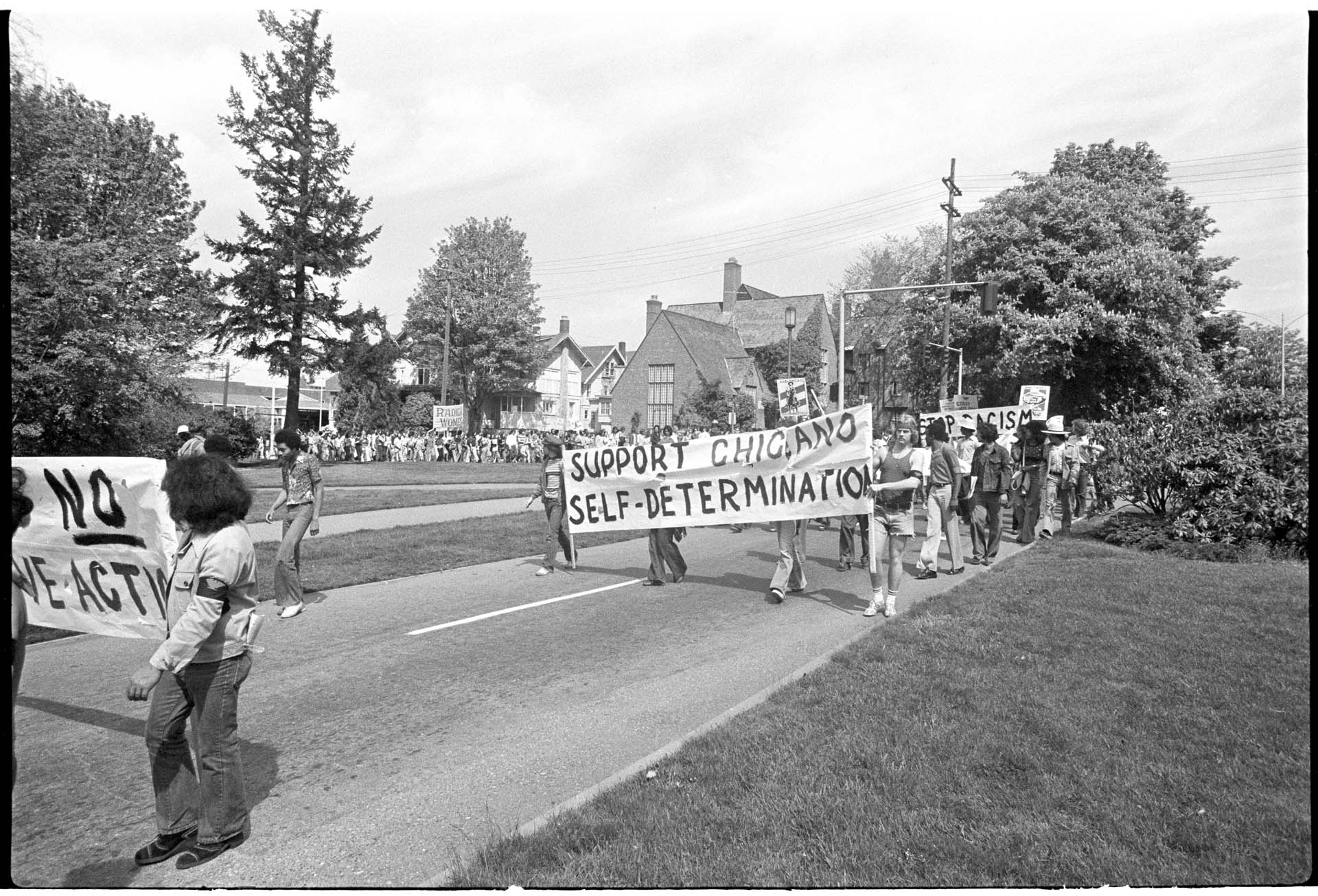 Image of UW students marching to protest Chicano staff dismissals, Seattle, May 13, 1975