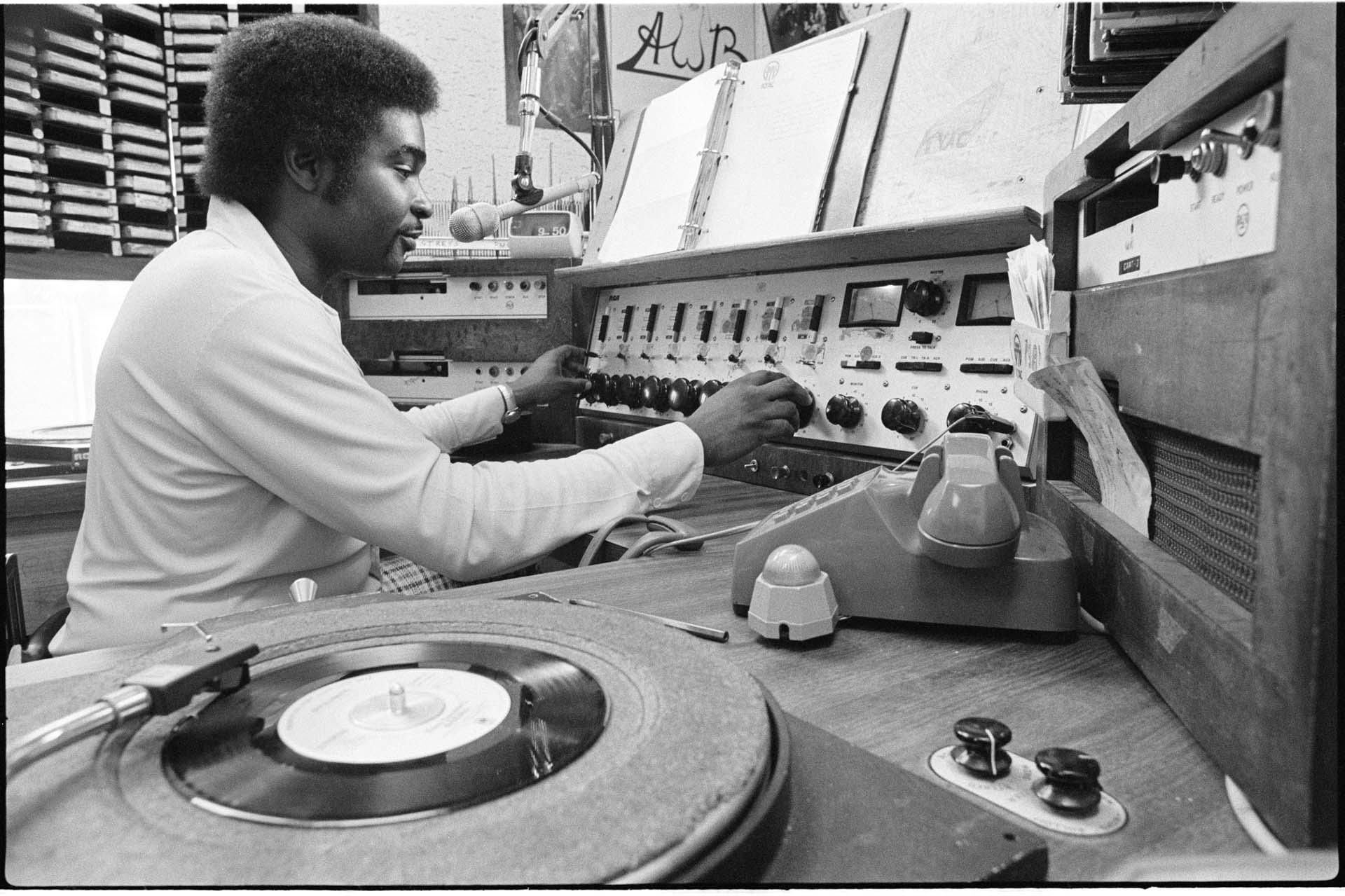 Image of Robert L. Scott in booth at KYAC radio station, Seattle, May 1975