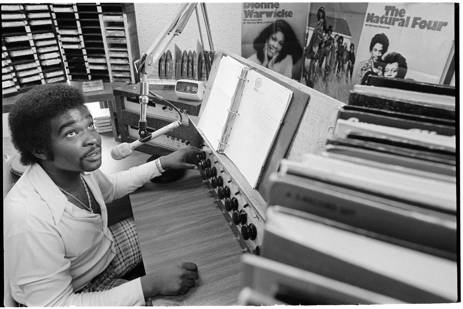 Image of Robert L. Scott in booth at KYAC radio station, Seattle, May 1975