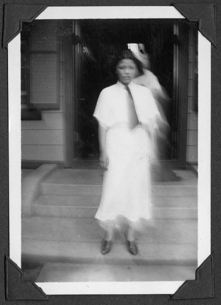 Image of Woman standing on step in Japan, circa 1938