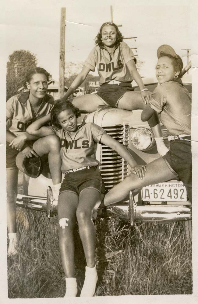 Image of Four Owls Club softball players on car, Seattle circa 1938