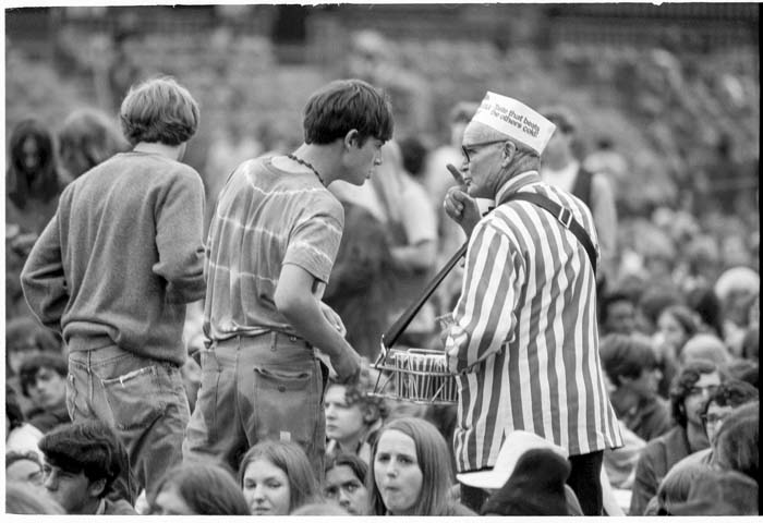 Image of Fan talking to soda vendor at Jimi Hendrix concert, Seattle, July 26, 1970