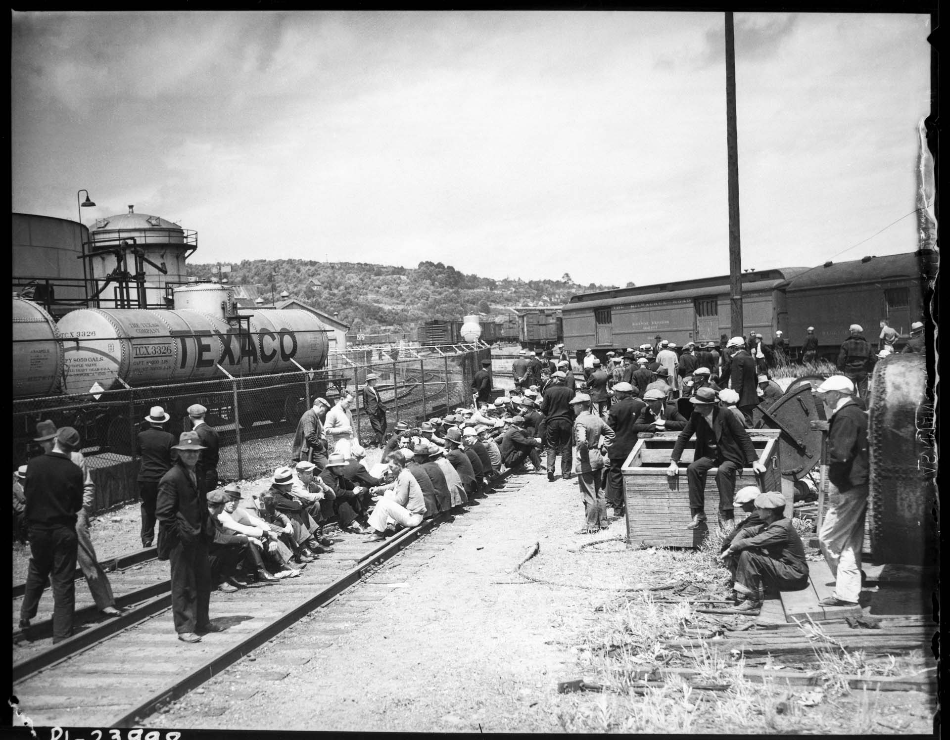 Image of Striking longshoremen blocking train tracks at Pier 40, Smith Cove, Seattle, July 19, 1934