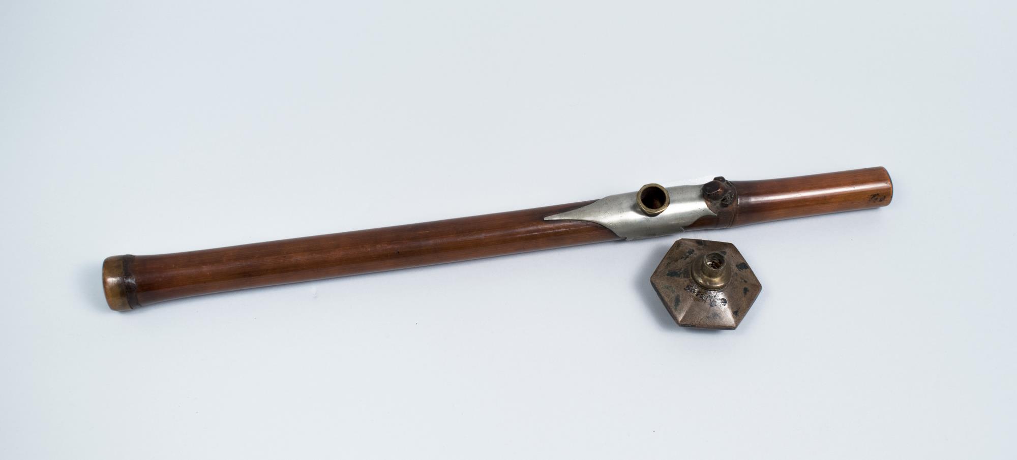 Bamboo opium pipe confiscated in police raid in Seattle's