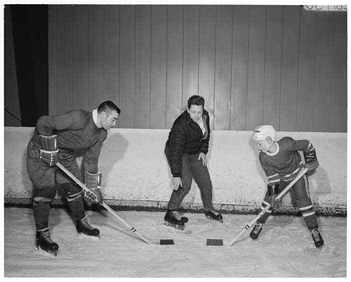 Image of Guyle Fielder and Clarence McGlothlin with hockey sticks, Seattle, January 1965