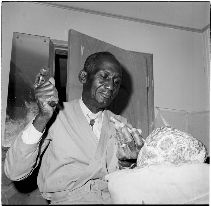 Image of James Washington Jr. carving a sculpture, Seattle, August 1965